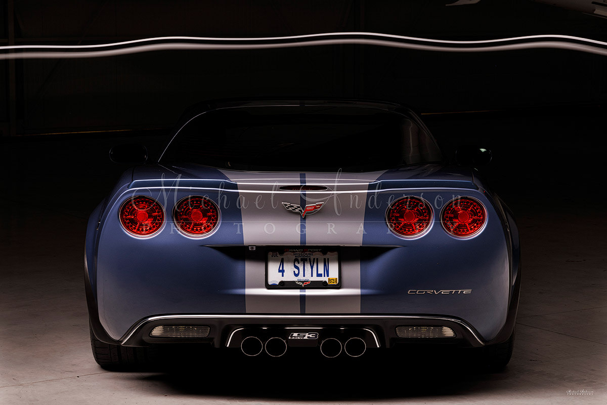 The pre-light painting photograph of the rear end of a 2013, 60th Anniversary, Corvette Grand Sport 3LT. This beautiful car has ZR1 Color matched rear Spoiler and Eagle Eye Led Halo Tail Lights.