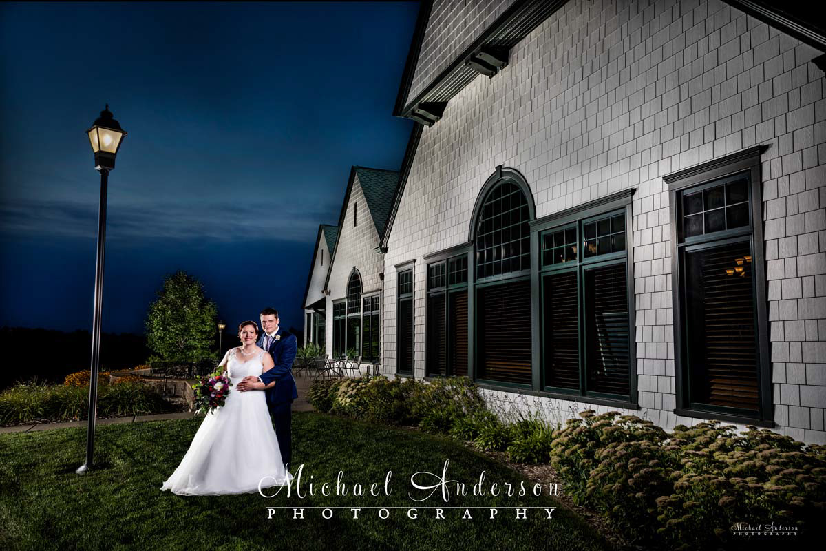A pretty light painted wedding photo of the bride and groom at sunset at their Keller Golf Course wedding reception in Maplewood, MN.
