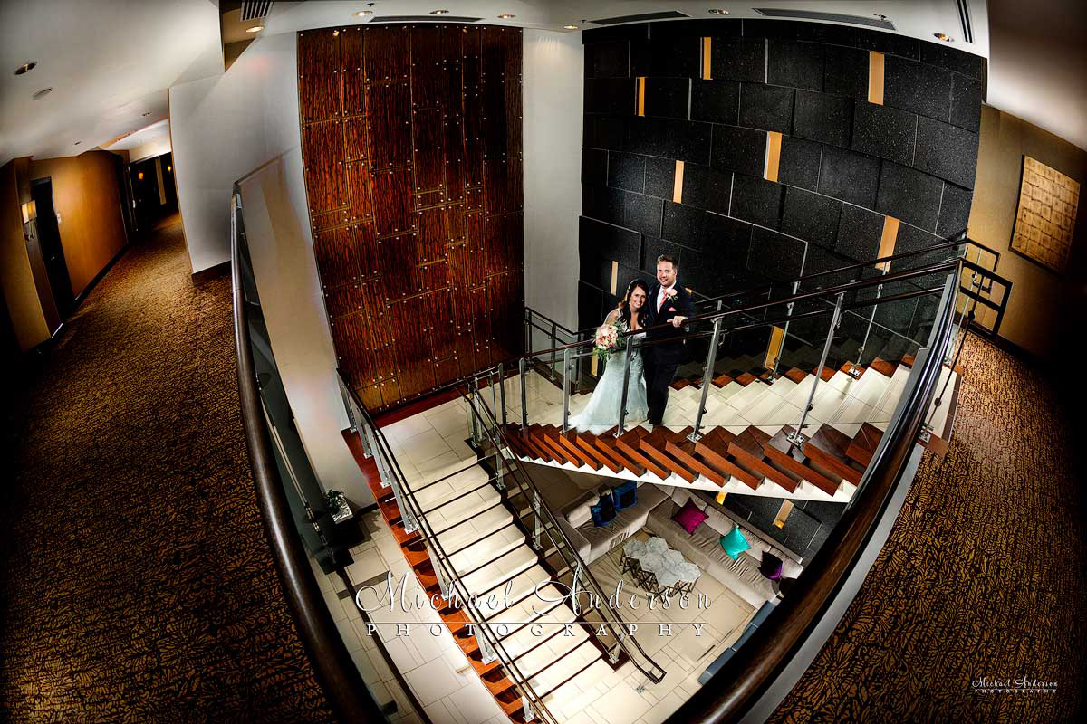 A pretty light painted wedding photo that was created on the lobby staircase at the Hilton Minneapolis Bloomington hotel.