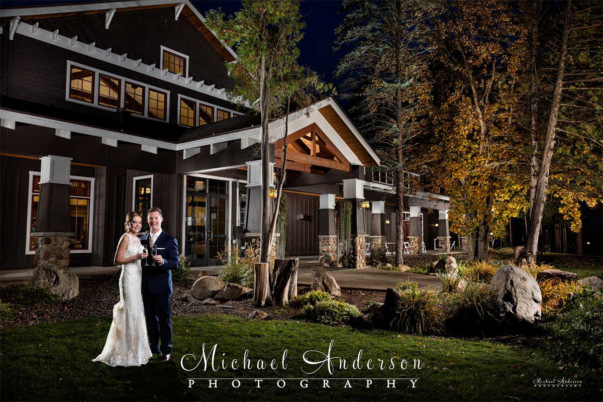 A beautiful light painted fall wedding photograph of the bride and groom at The Gull Lake Center at Grandview Lodge in Nisswa, MN.