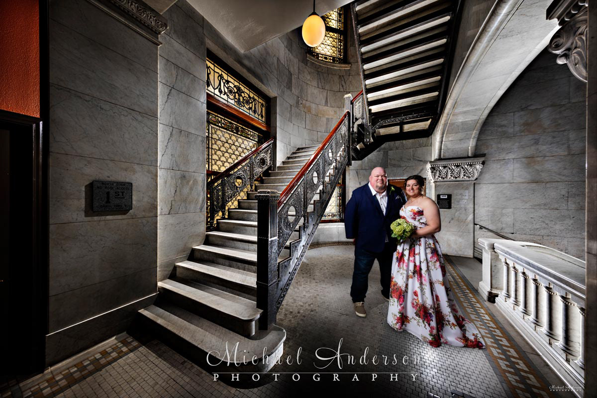 A pretty wedding photography light painting of a bride and groom. Image was created before their wedding ceremony at the Minneapolis City Hall and Hennepin County Courthouse.