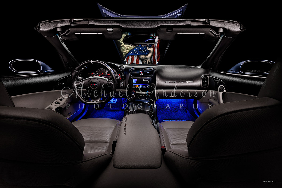 The light painting of the immaculate interior, with the hand-painted hood liner seen through the windshield.