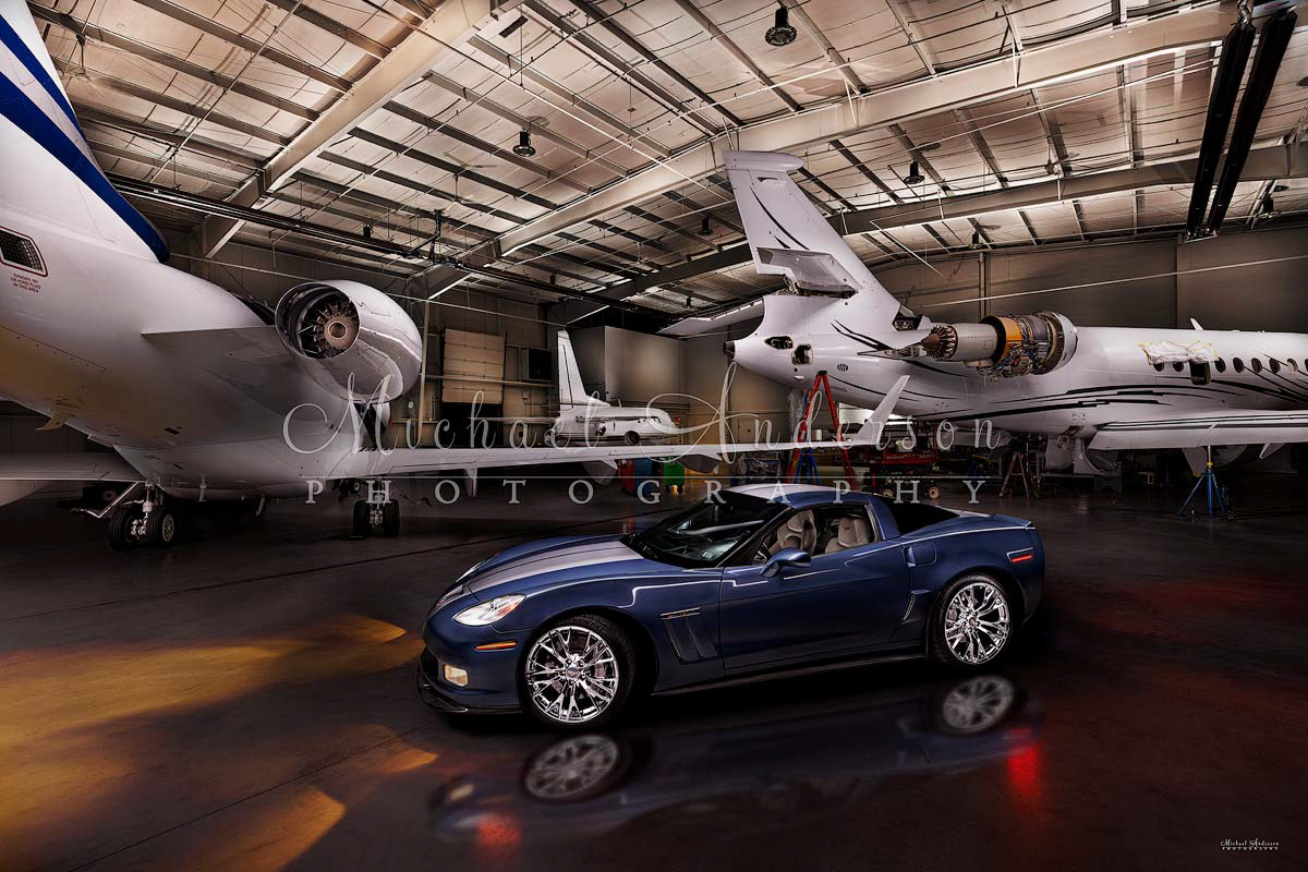 An amazing light painted photograph of a 2013 60th Anniversary Corvette Grand Sport 3LT in a hangar with 3 corporate jets. This cool photograph was created at AVMATS in the Spirit of St. Louis Airport in Chesterfield., Missouri.