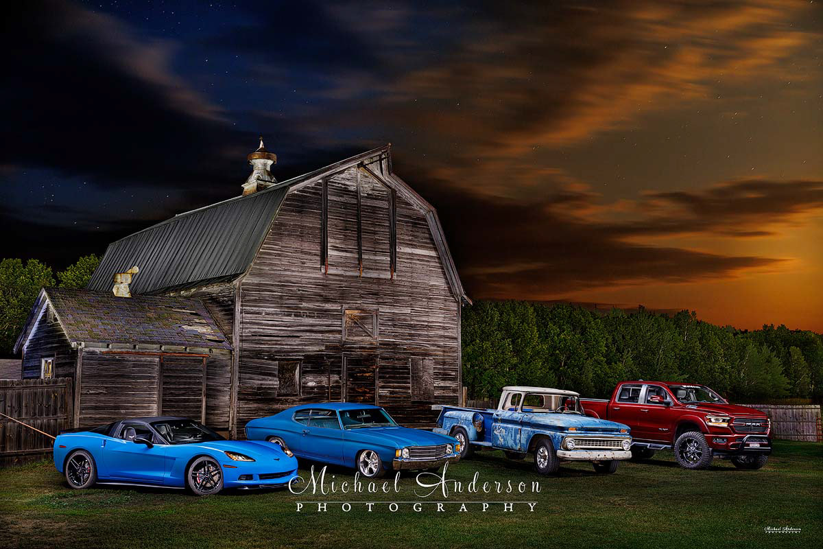 A cool light painted photograph of a 2009 Corvette, a 1972 Chevelle, a 1963 Chevy Stepside C20, and a 2021 Dodge Ram truck. This beautiful image was created during the Canadian wildfires in the summer of 2025.