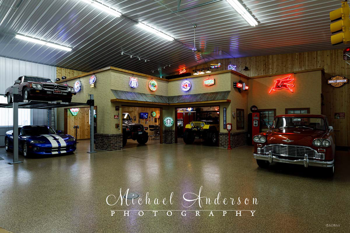 Photo of five cars inside a garage condo prior to light painting all of them. The vehicles are a 1966 Checker Marathon Wagon, a 1989 Mercedes 450SL on a Wildfire Lift, a 1996 Dodge Viper GTS Coupe, a 1980 Jeep CJ-5, and a 2003 Jeep Rubicon.