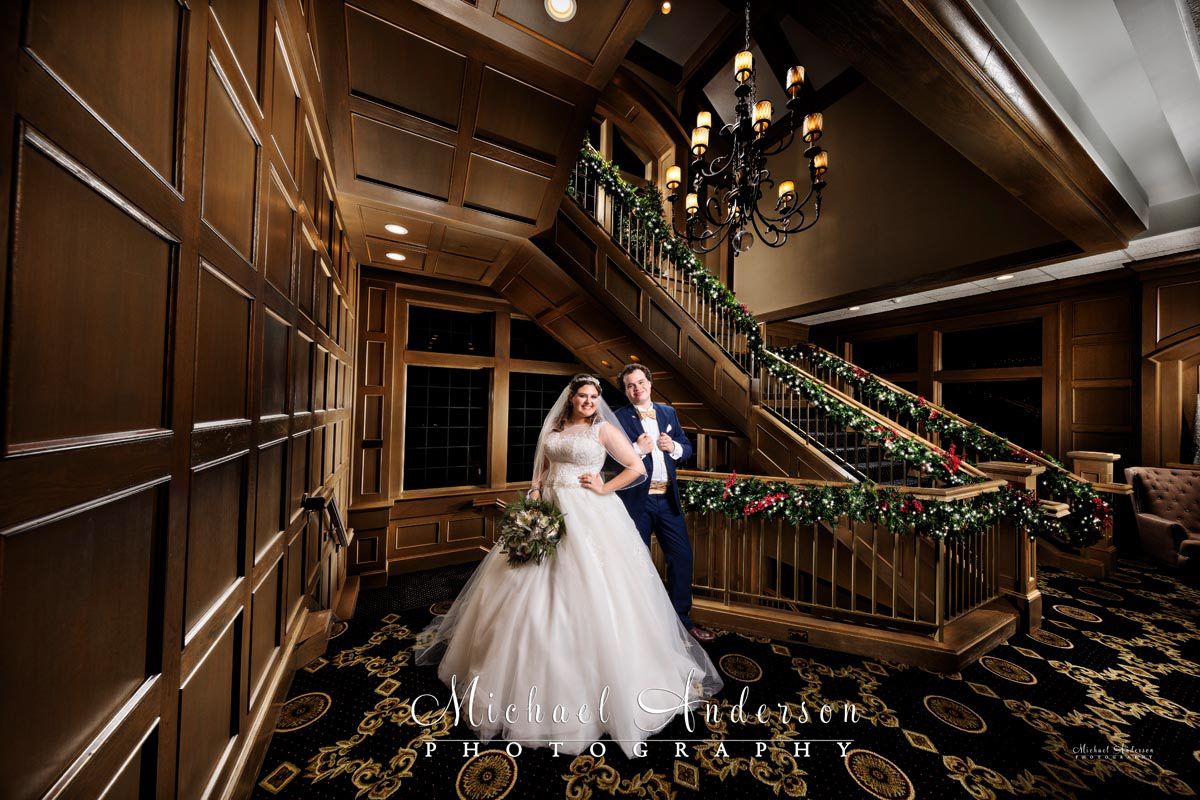 A pretty light painted holiday wedding photograph at the Grand Staircase at Rush Creek Golf Course in Maple Grove, MN.