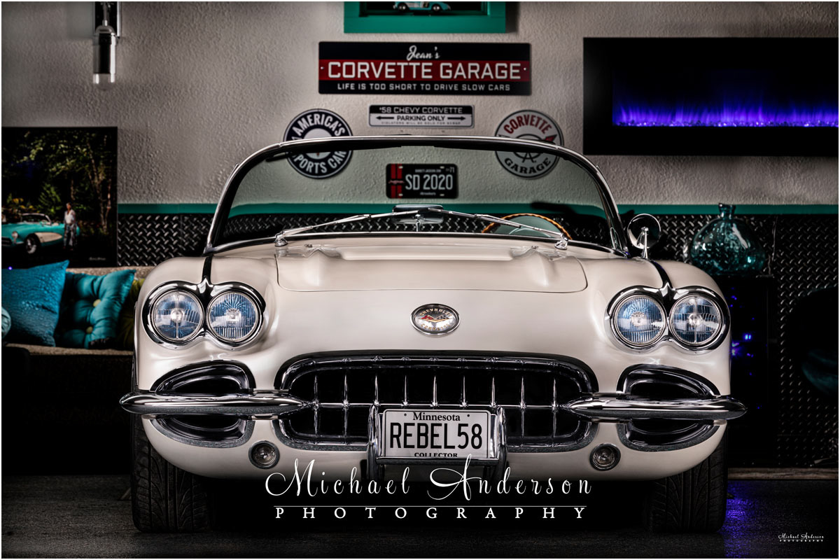 Light painted photo of a mint condition '58 C1 Corvette Convertible in a custom "She Shed".