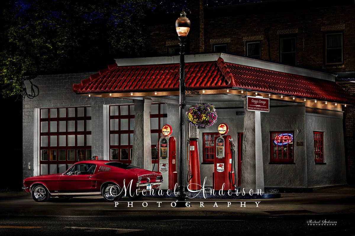 A stunning light painted photograph of a red 67 Ford Mustang at Gregg's Vintage Gas Station in Carver, MN.