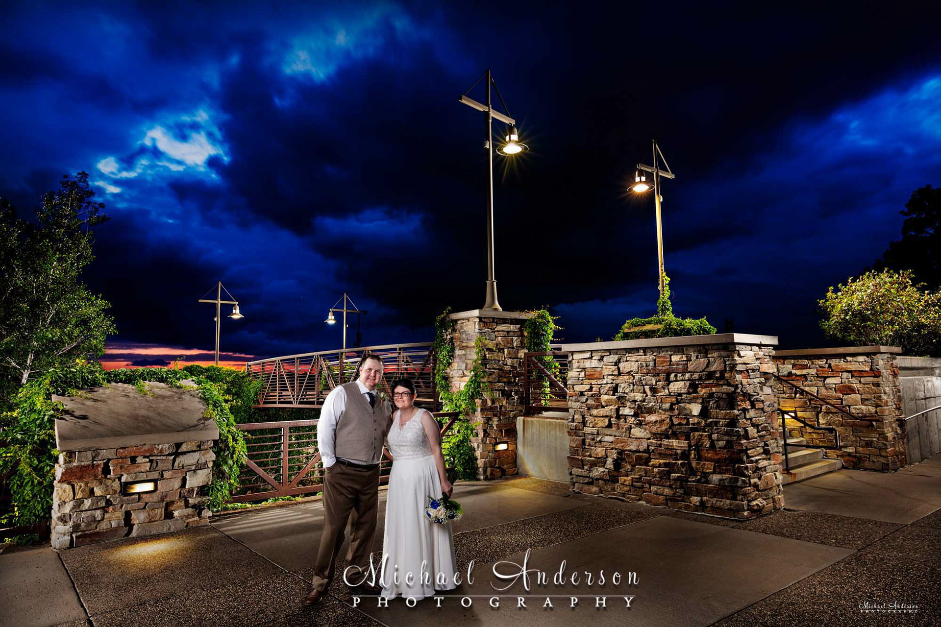 A pretty light painted wedding photograph, under a stormy sky, created at the Elm Creek Chalet in Minneapolis, MN.