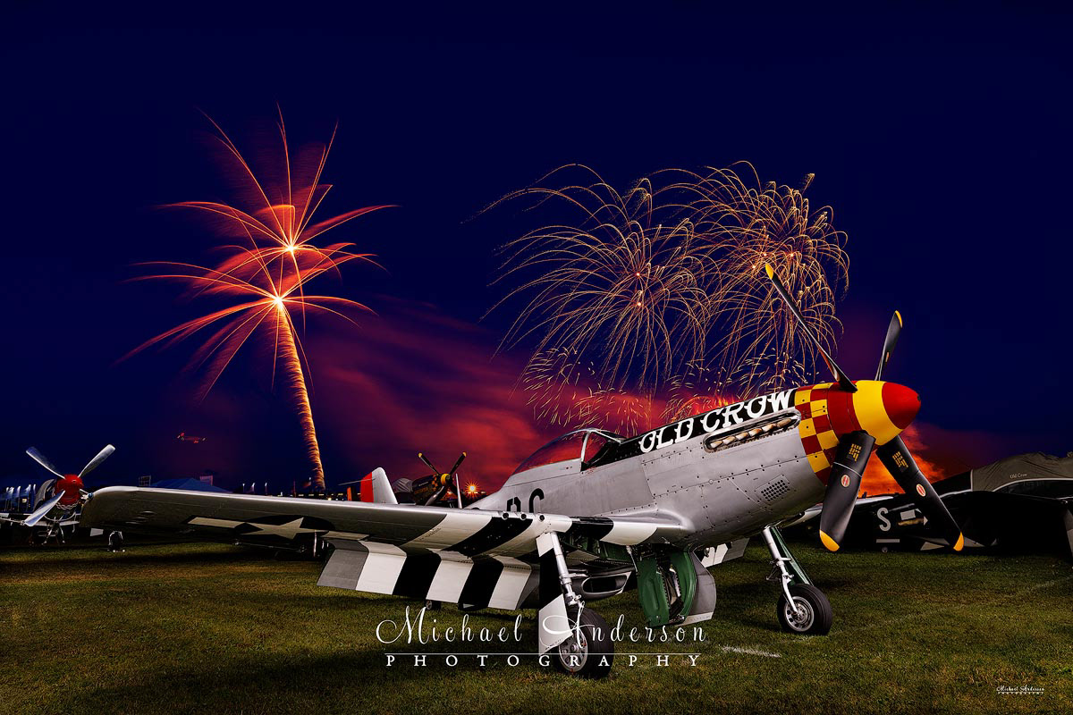 A cool light painted photograph of the P-51 Mustang fighter, "Old Crow". Image was created during the fireworks at AirVenture in Oshkosh, Wisconsin.