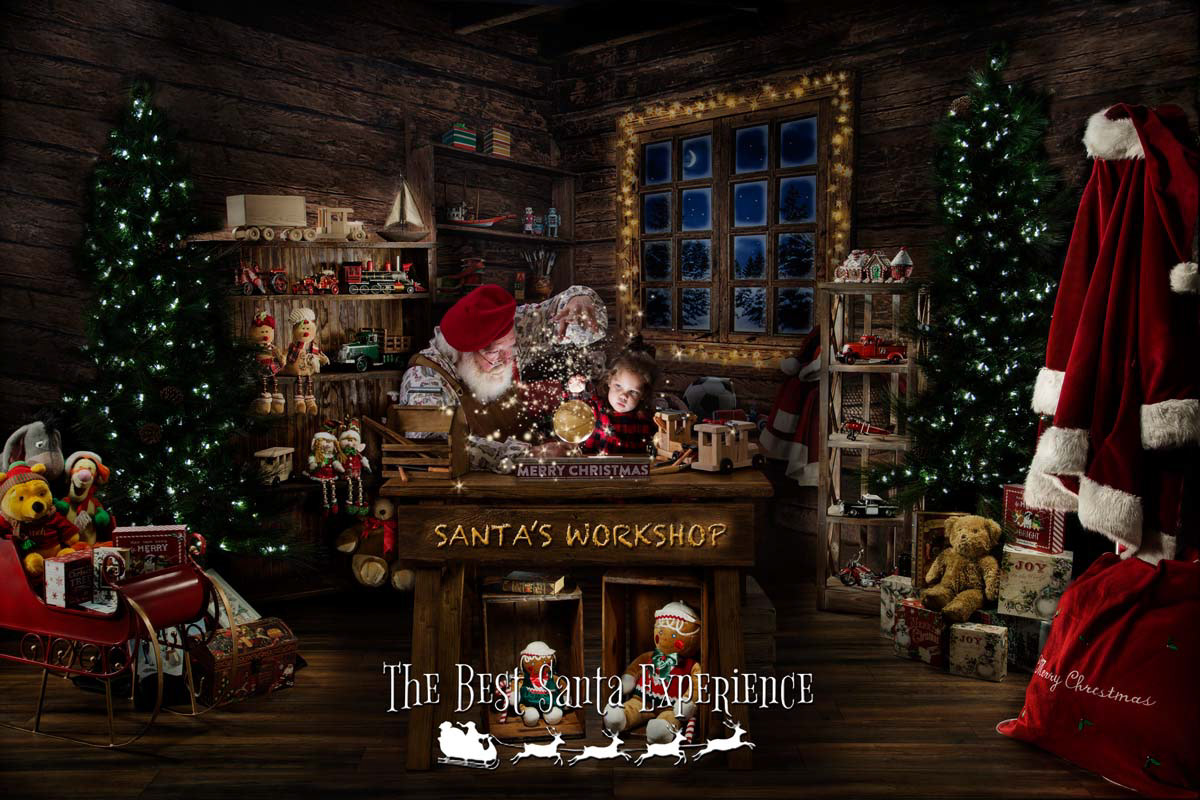 A beautiful light painted Christmas photo of a little girl and Santa Claus in his Magic Workshop.