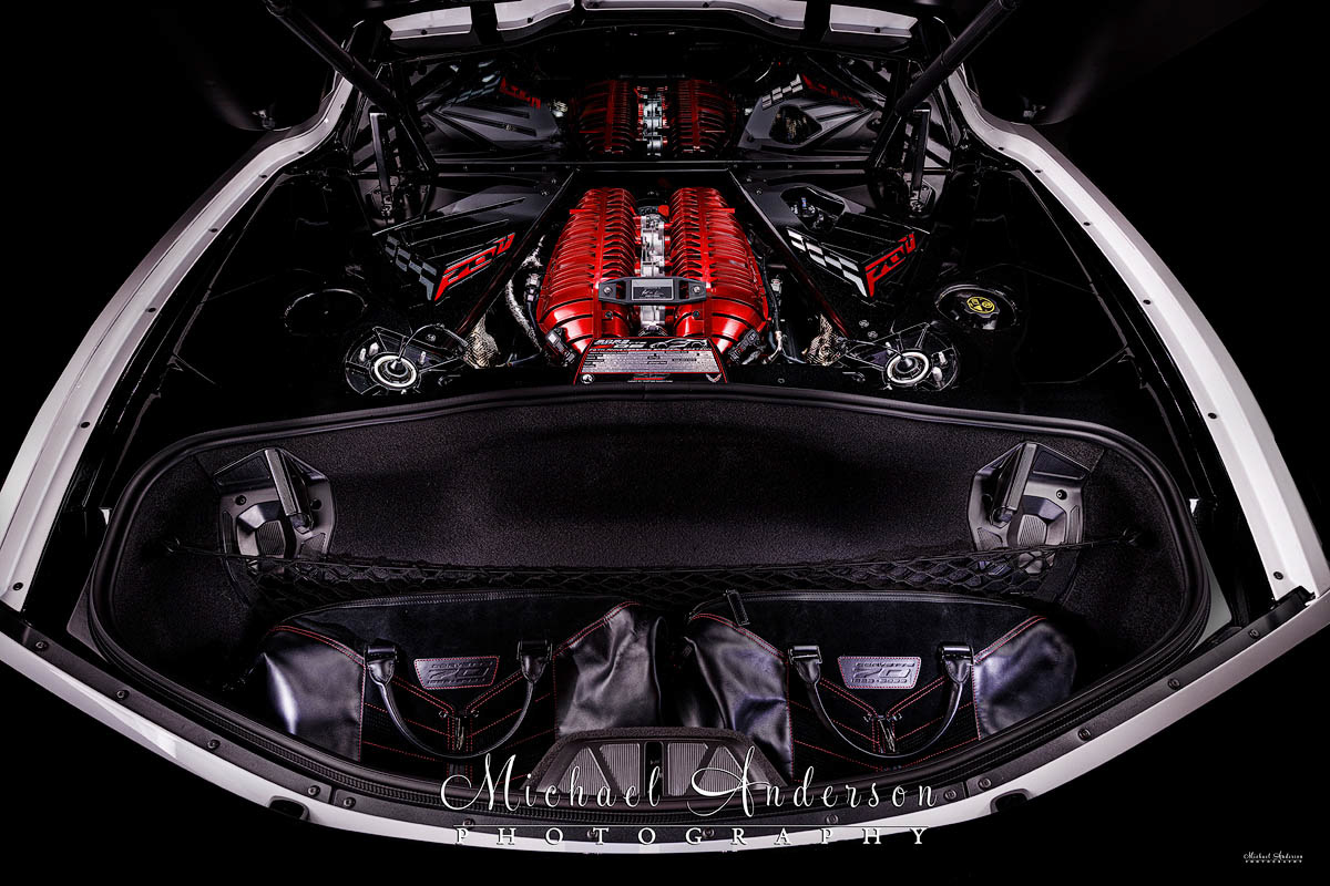 A cool light painted photograph of the engine compartment of a 70th Anniversary Corvette Z06.