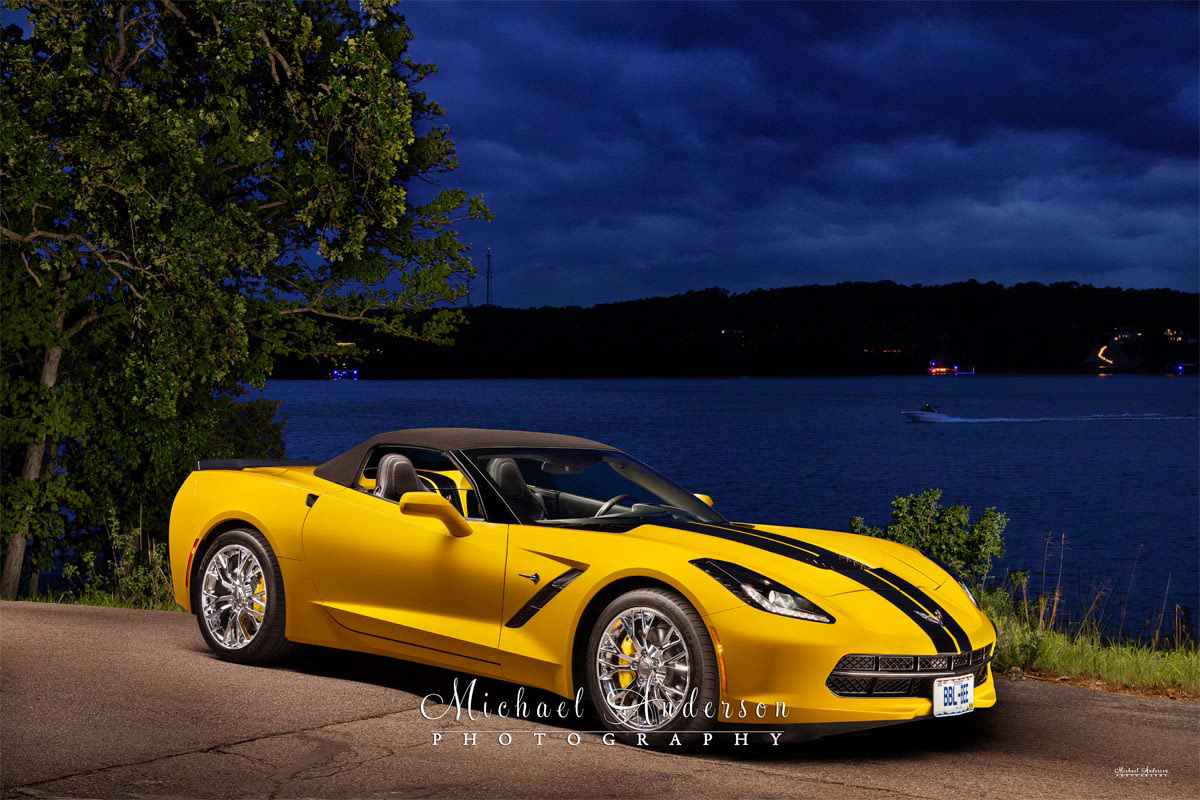 A beautiful light painted photo of a 2014 “Bumble Bee” Yellow Stingray Convertible with the top up. 