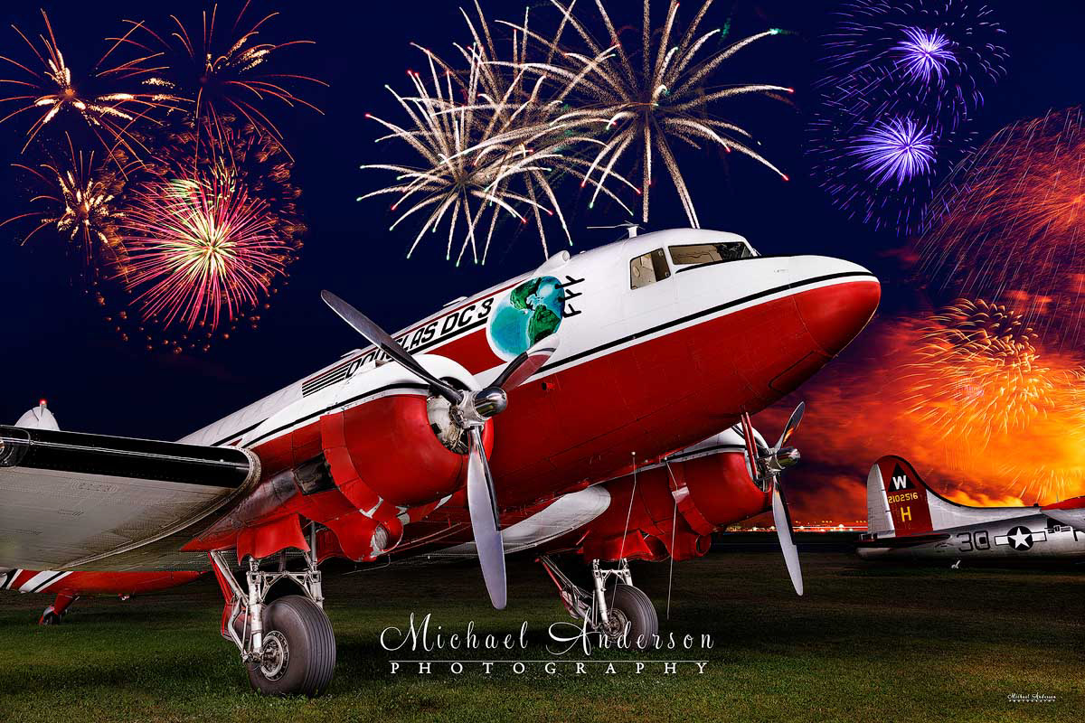 A pretty light painted photograph of the World War II Warbird, Douglas DC-3 N728G. Image was created during the 2025 AirVenture fireworks airshow in Oshkosh, WI.