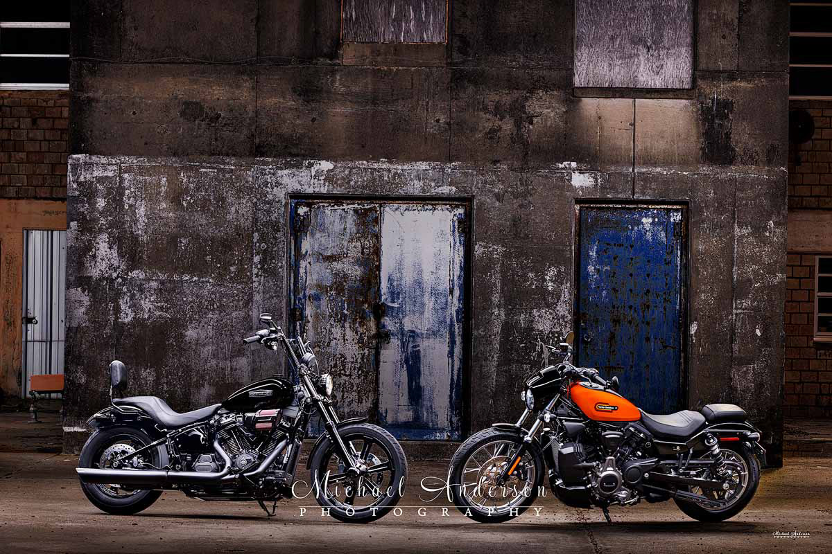 Cool light painted photograph of a 2025 Harley-Davidson Custom Street Bob and a 2024 Harley-Davidson Nightster Special.