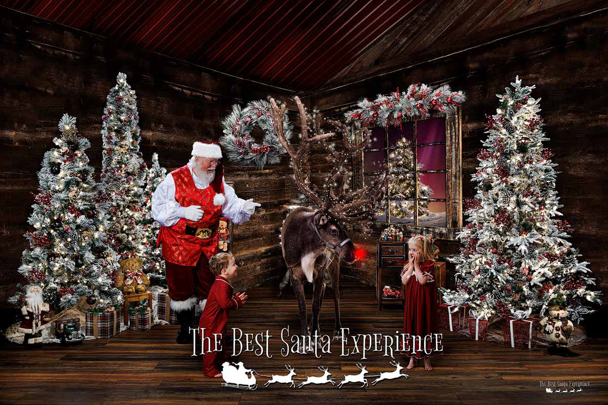 A beautiful light painted photograph of two cute kids, Santa Claus, and Rudolph the Red-Nosed Reindeer!