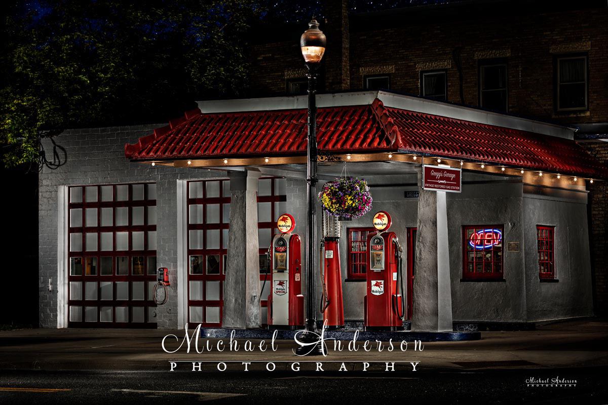 A stunning light painted photograph of  Gregg's Garage Vintage Restored Gas Station in Carver, Minnesota.