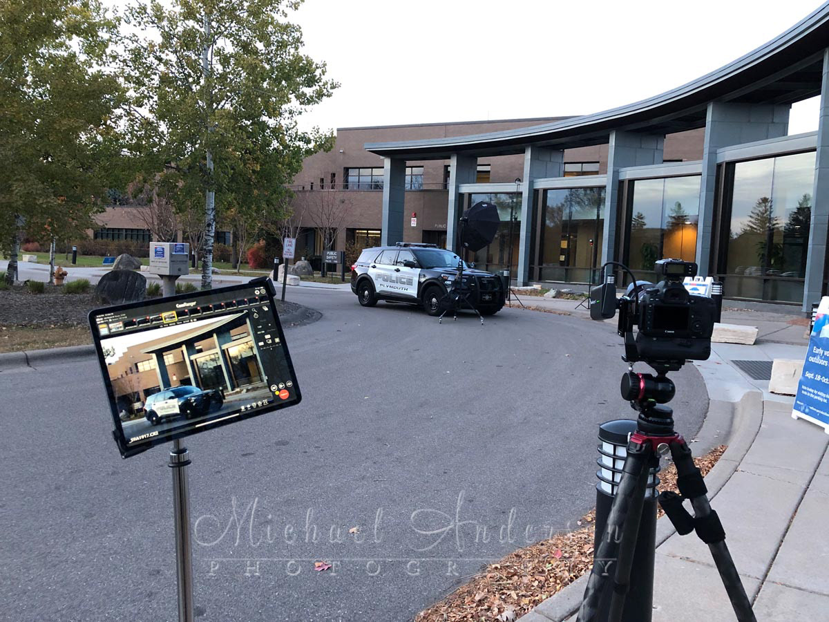 Behind-the-scenes of a Plymouth Police Department squad car before light painting it and City Hall.