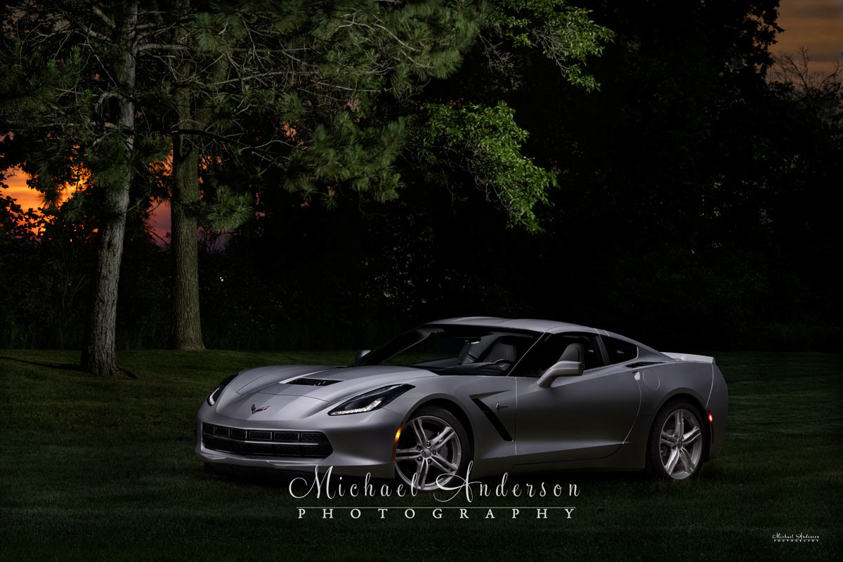 A beautiful light painted photograph of a sleek, 2017 Chevrolet Corvette, and a pretty sunset. Photo was created in a park in Wisconsin.