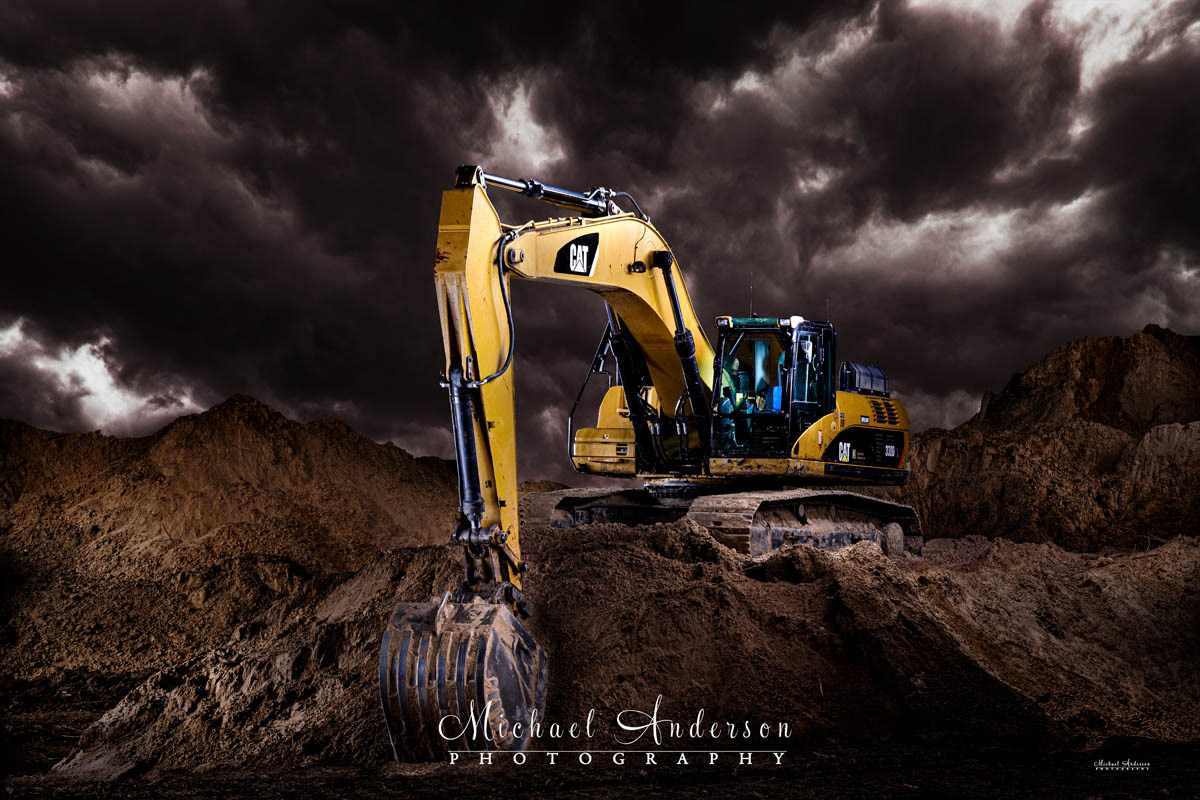 A cool light painted photograph of a CATERPILLAR 330D L Excavator at a construction site in Blaine, Minnesota.