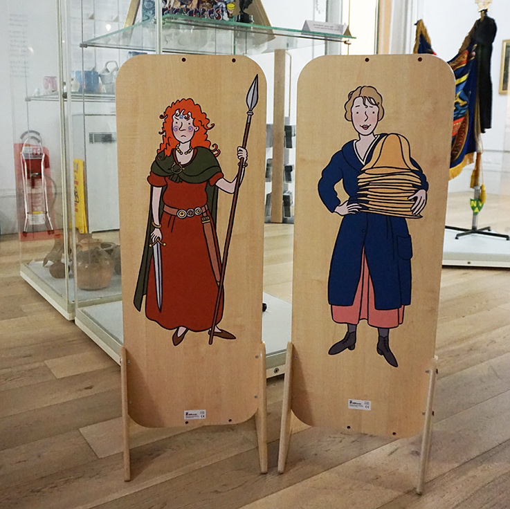Children's dressing-up mirrors with vinyl stickers of Queen Boudica and a female hat maker on the reverse side.