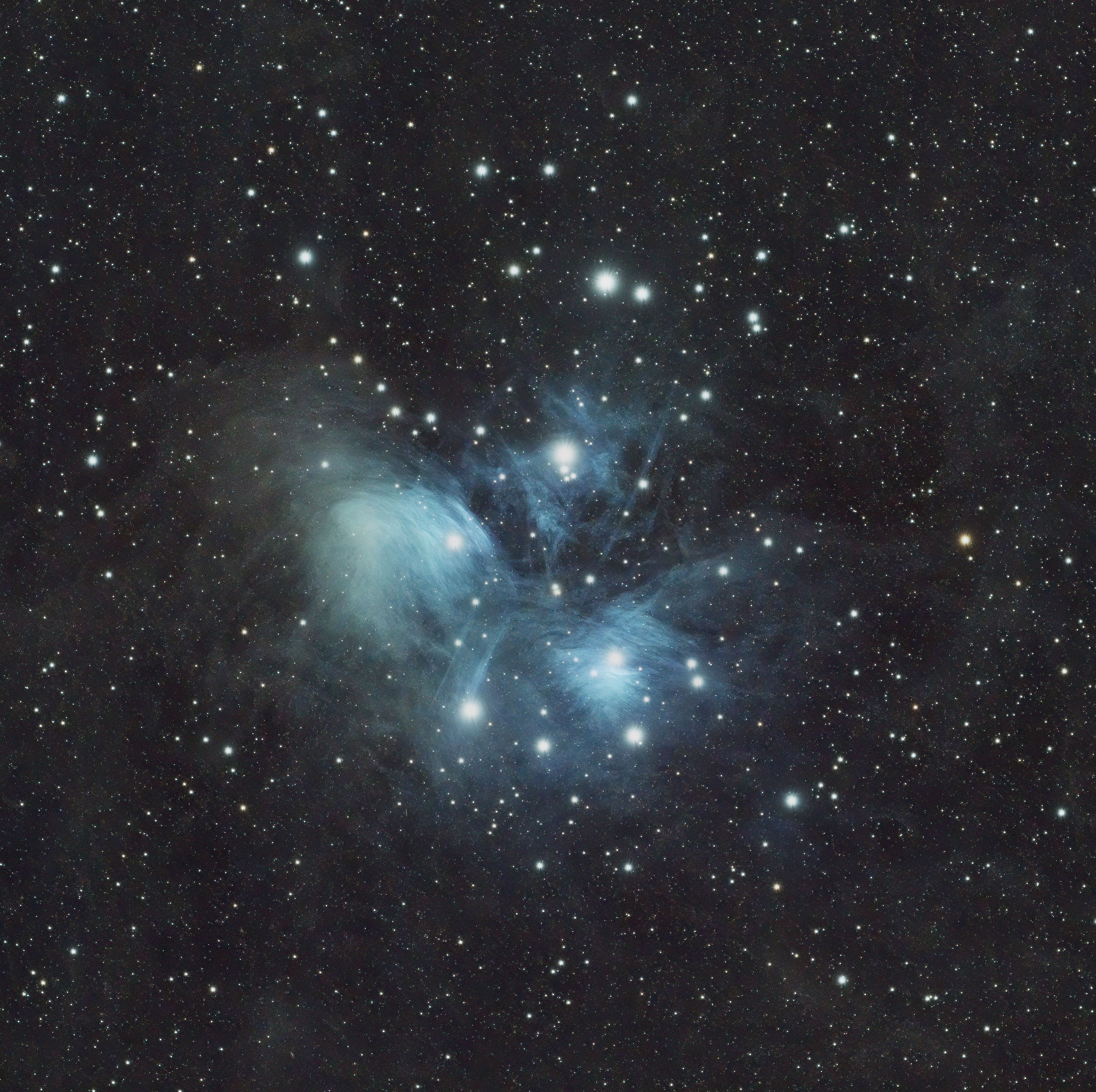 Pleiades (Messier 45), widely known as the Seven Sisters, is a bright open star cluster located about 444 light-years away in the northwest section of the constellation Taurus. It contains over 1,000 young, hot blue stars, though typically only six or seven are distinct to the naked eye.