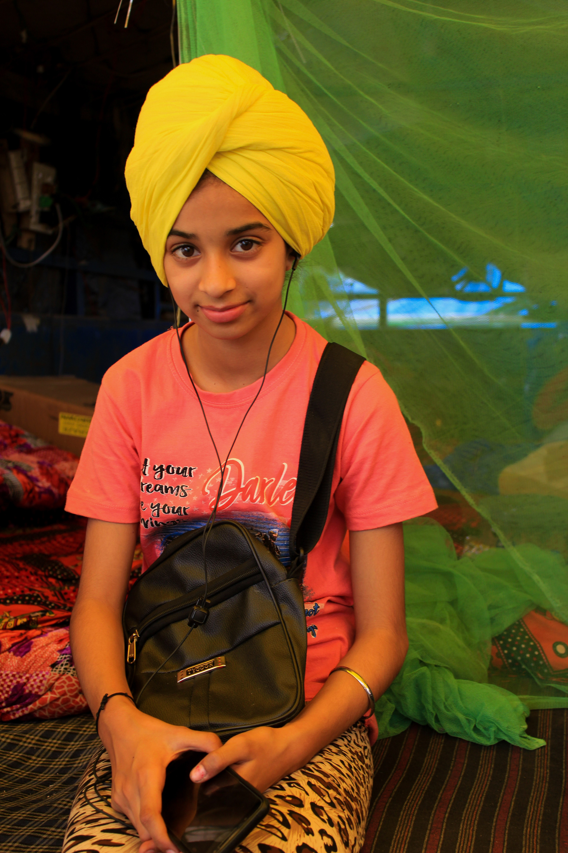 Mehak Preet Kaur, 11, has been sitting at the protest for a week with her family. She left her school for a while to join the protests. Even though in the Sikh religion girls do not wear turbans, Kaur dons one to show her solidarity for the farmer's movement.