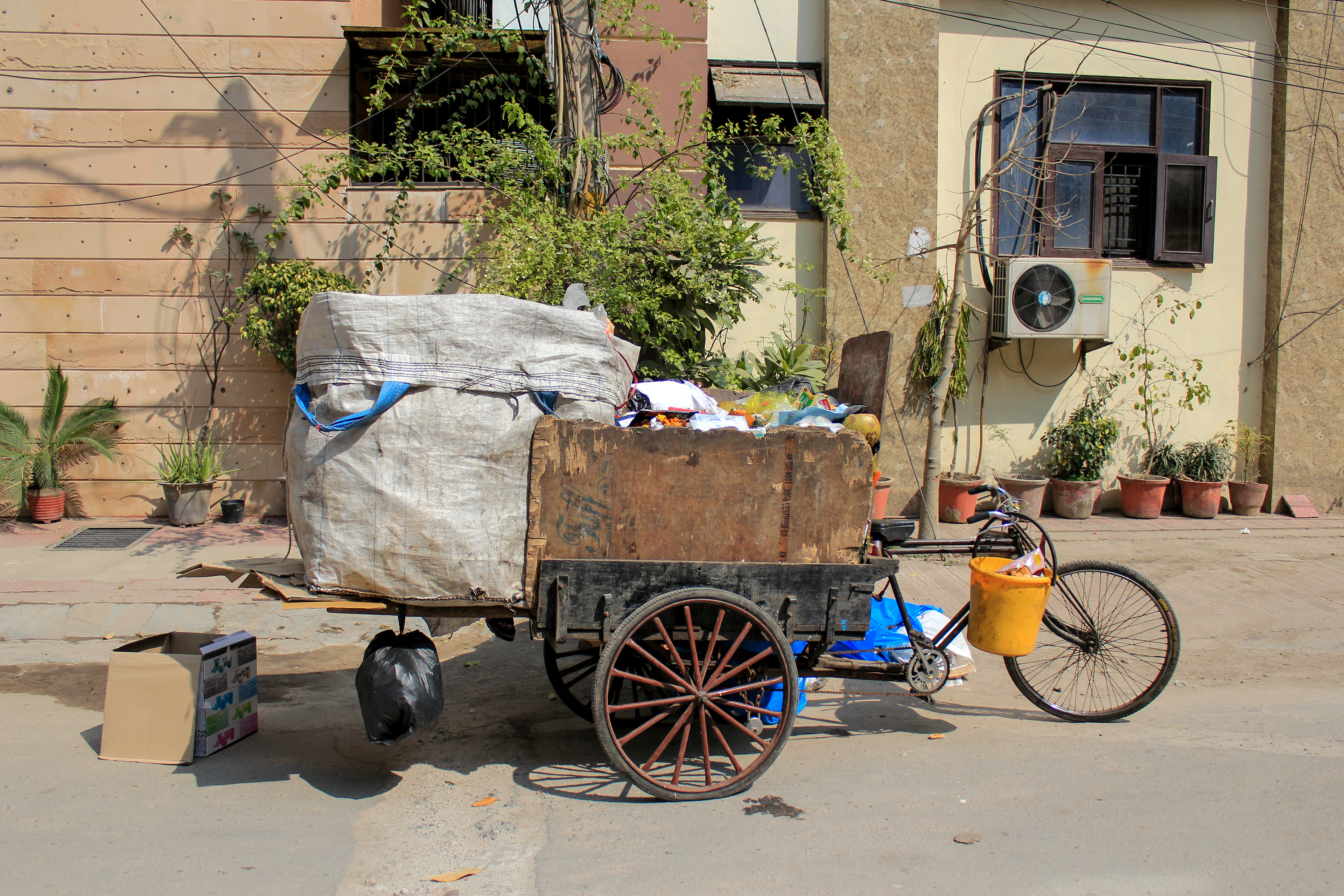 The garbagemen collect weekly garbages from the houses of Madhuban neighborhood in New Delhi, India.