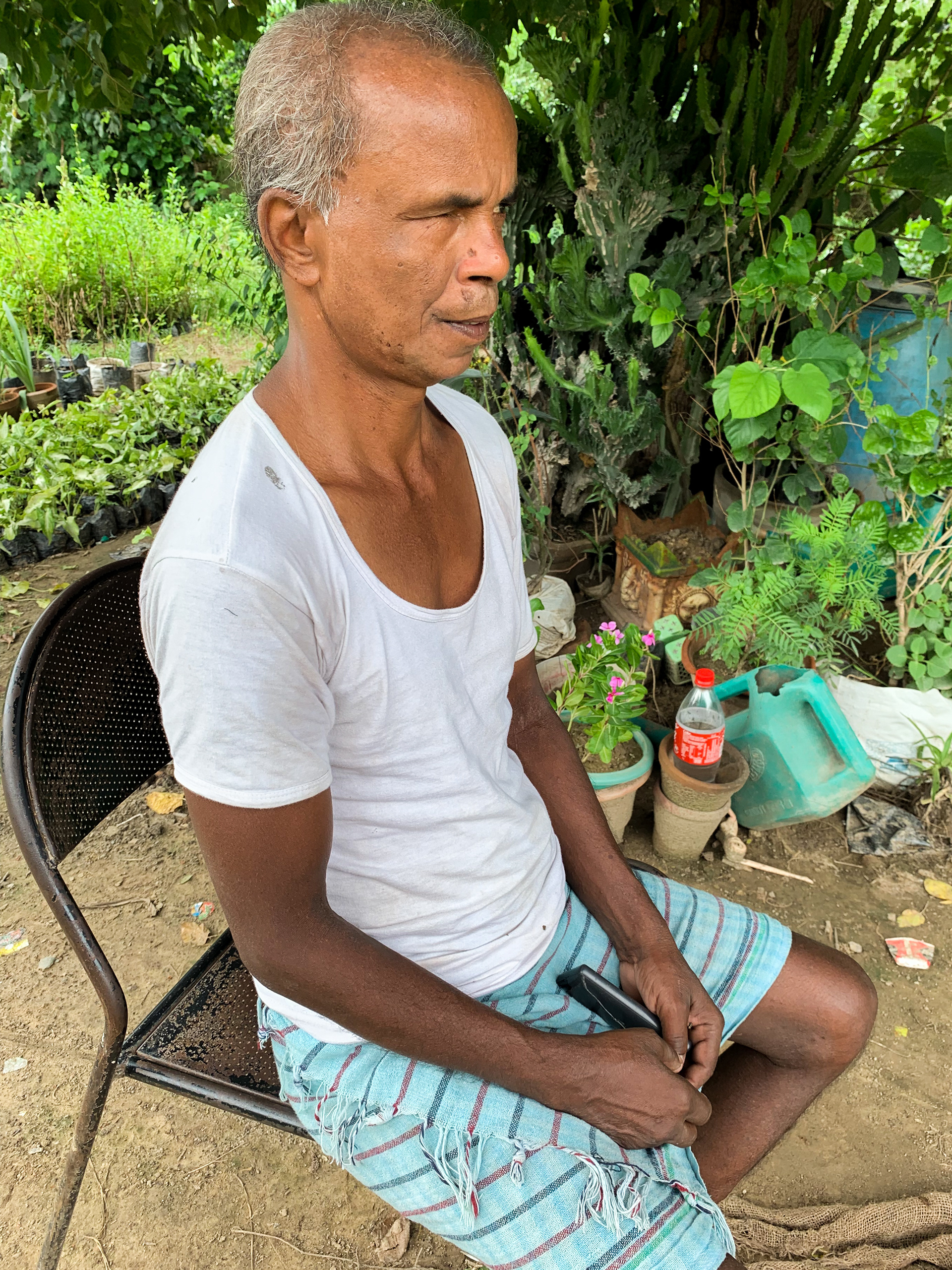 Ram Vilas is a caretaker at the plant nursery on the banks of Yamuna Vihar. He belongs to a village in Begusarai, Bihar. July 22, 2022.