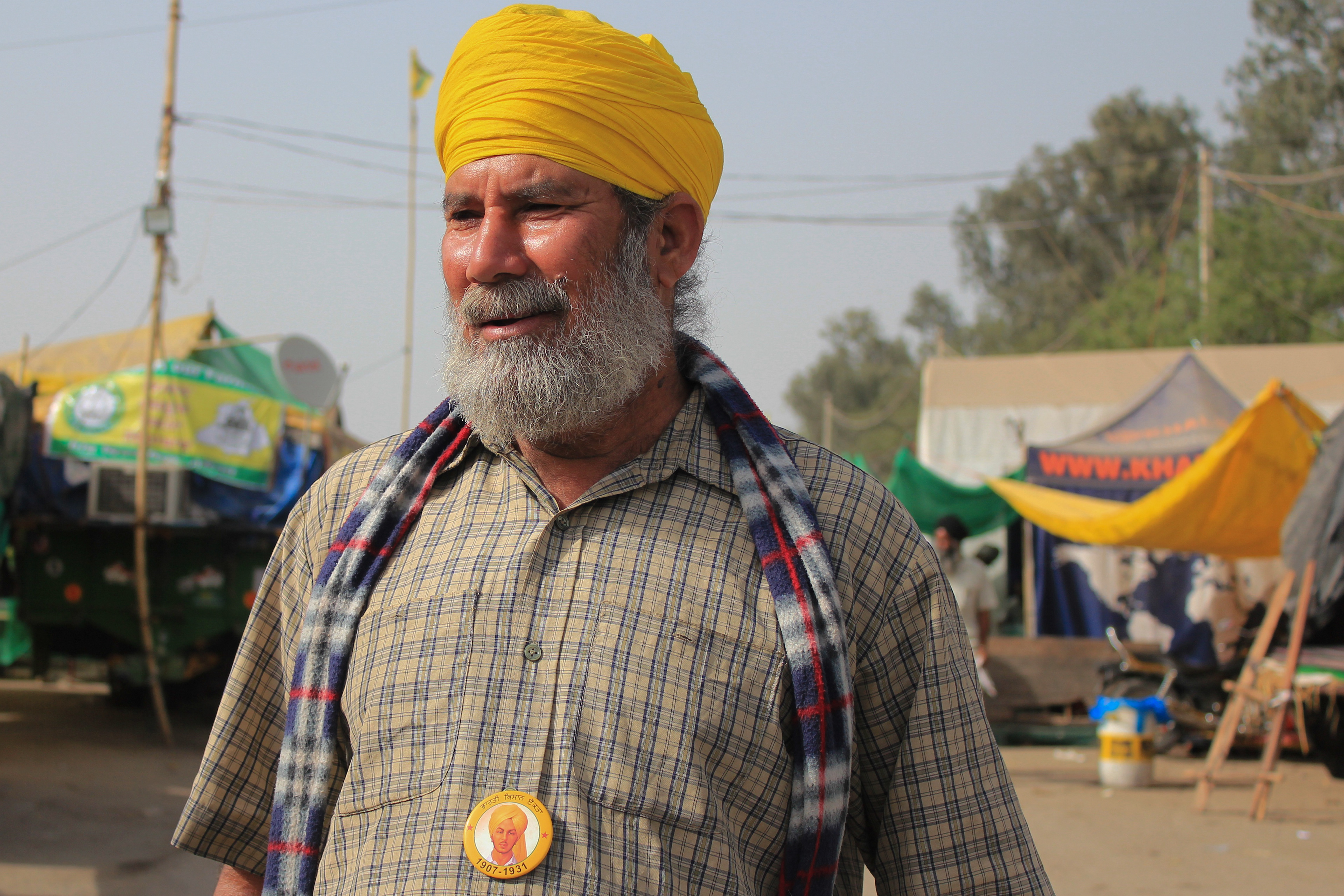 Harvinder Singh Sindhu, a volleyball coach, left his job to attend the Farm Protests at Singhu border. His message to Narendra Modi, the Prime Minister of India is, "Beware, Modi: Sikh farmers are coming for you." He dons a badge of Subhash Chandra Bose, a freedom fighter who fought in India's independence struggle.