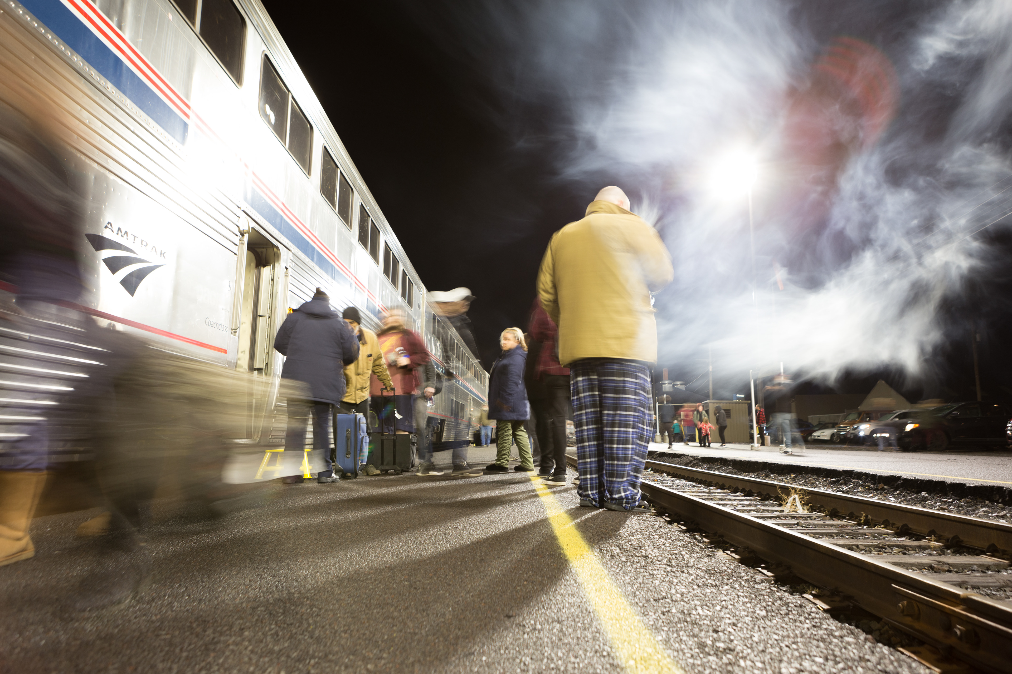 Amtrak passengers walk on the platform at Klamath Falls station as  they wait for the train to depart in December 2018.