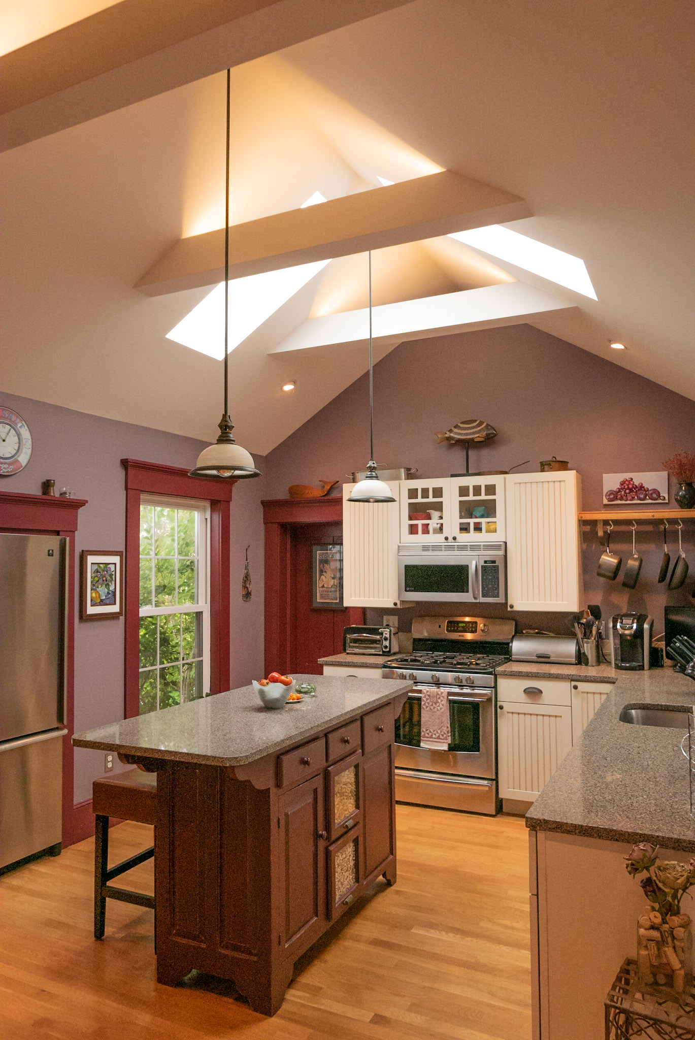 The kitchen got an opened up ceiling with skylights.