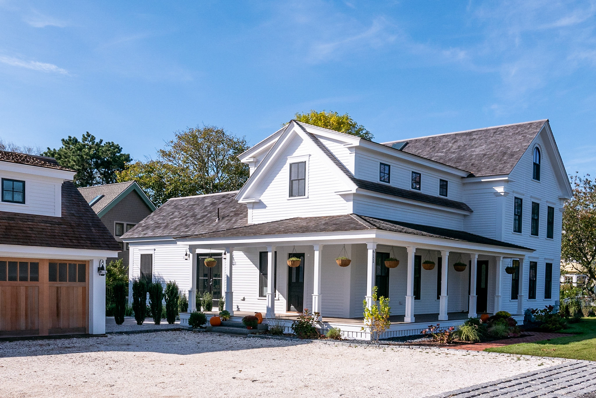 A complete renovation added new dormers and a wraparound porch.