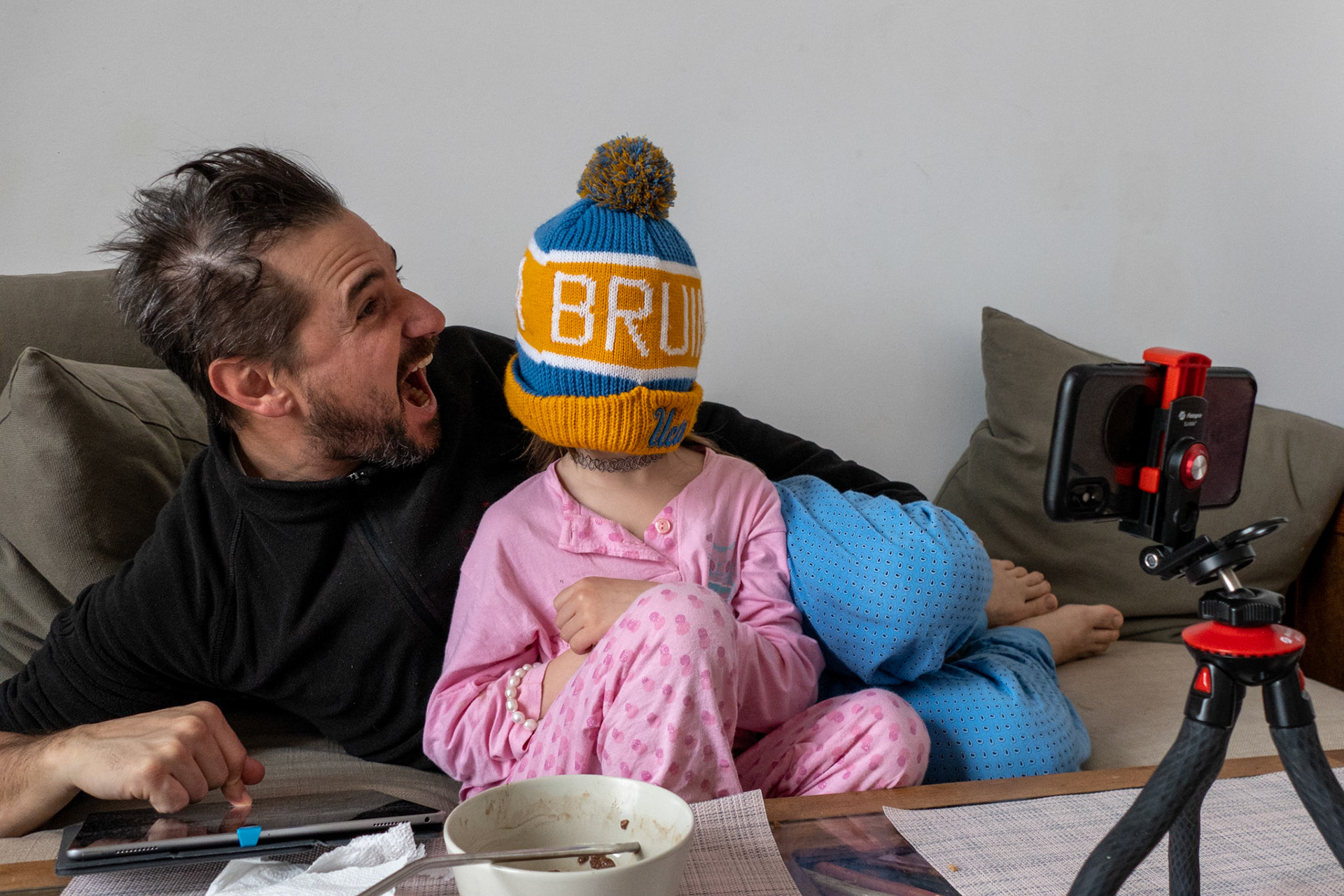 Video chatting with Sophie’s mother on the iPhone, while being at home in Barcelona for the mandatory lockdown, daddy pretends he’s eating her head. Her mother who’s been stranded in Milan, Italy for the past two weeks due to the Covid-19 crisis.