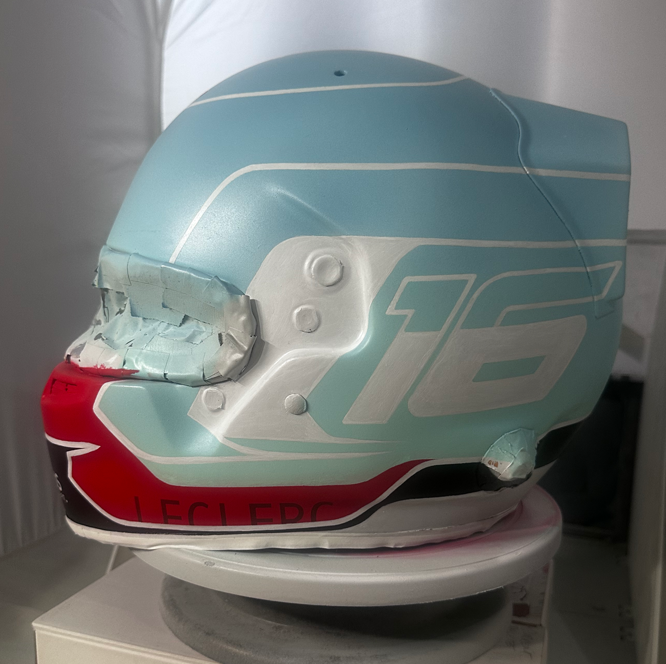 After sanding down the helmet and covering completely with primer, I wanted to incorporate some of the original helmet details into my design. This ment I had to repaint the elements back onto the helmet. Everything you see on this helmet from here on was painted on by me. I learned A LOT.