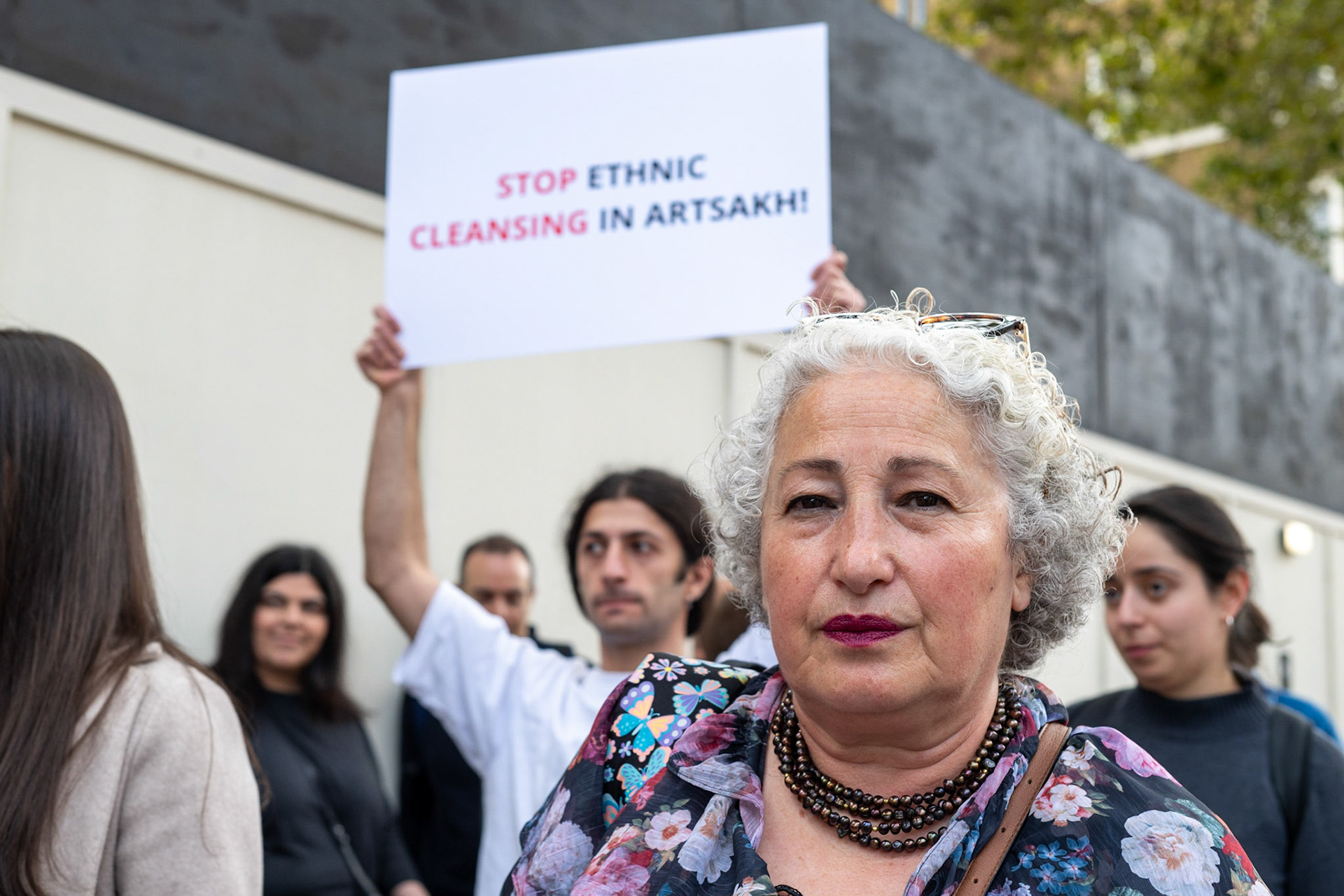 On September 30, 2023, at Downing St./EU Delegation Office, U.K., The United Committee of Armenian Organisation (ACCC) and the Diocese of the Armenian Church in the United Kingdom and Ireland gathered to denounce ethnic cleansing in the Republic of Artsakh (Nagorno-Karabakh). Bishop Hovakim Marukyan (not pictured) of the Diocese and representatives from the Armenian National Committee (ANC) were present. Larissa (pictured, surname provided) spoke emtionally about her upbringing in Baku, living in Ukraine and now in the U.K. The event occurred amid President Samwel Shrahramanyan's call to dissolve the Republic by January 1, 2024, a move met with skepticism about its authenticity, given concerns of possible coercion. Azerbaijan had declared complete control over the enclave.