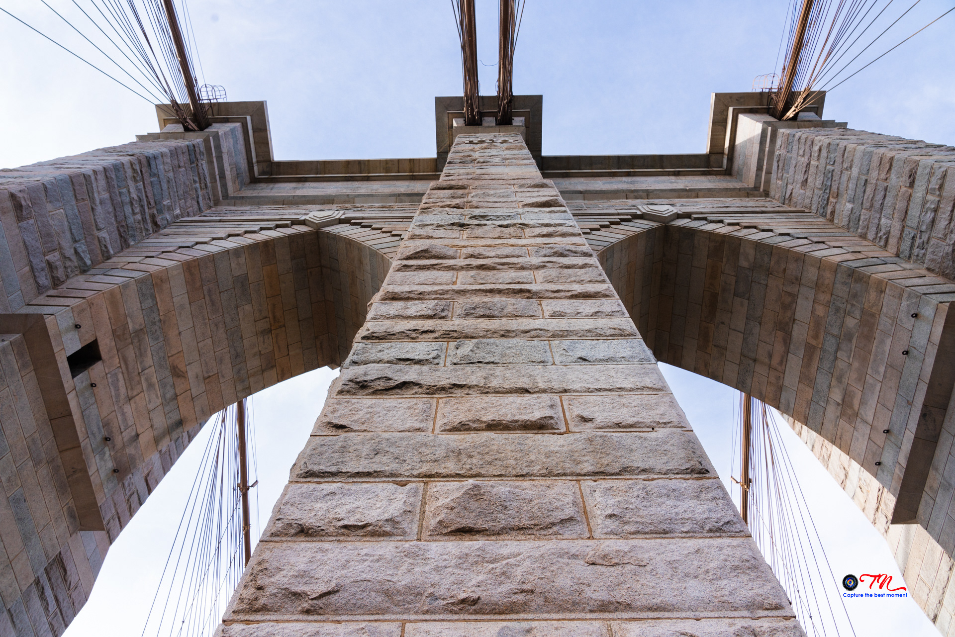Look up to the main suspension tower of the famous Brooklyn Bridge, NYC, USA (Mar 2024)