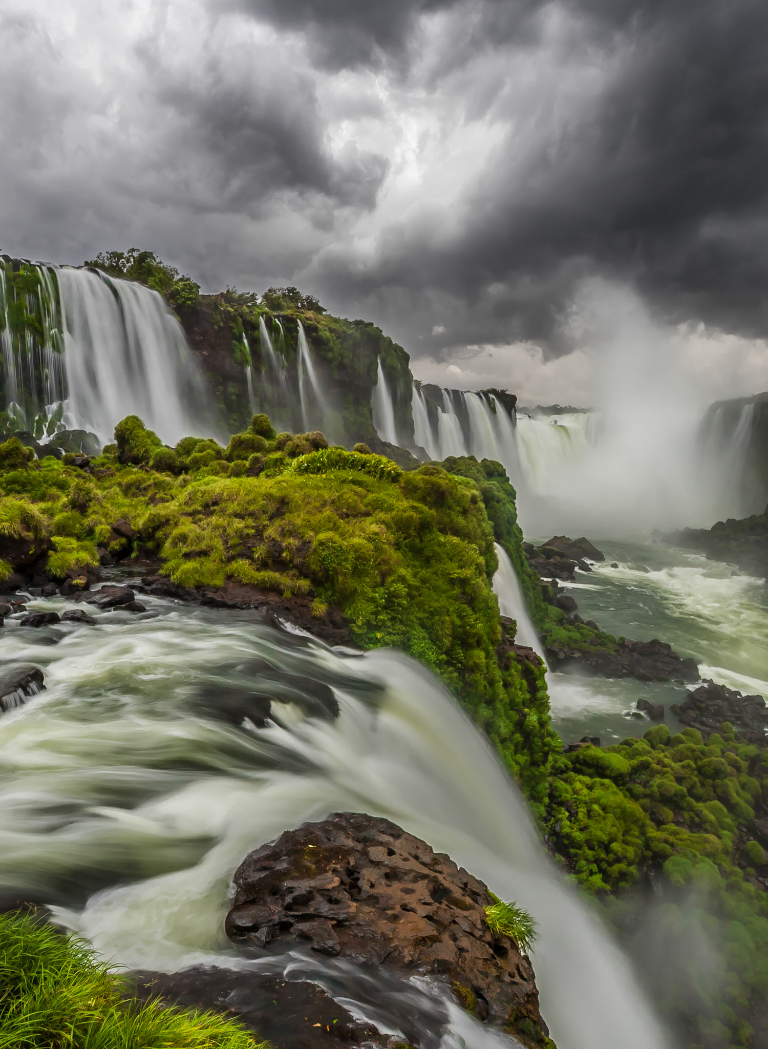 I arrived on the Brasilian side of Iguazu Falls late in the afternoon and had watched the clouds gather as we travelled towards the national park. Once in the park, it became a foot race down a jungle trail to reach a good view of Devil's Throat before the storm passed overhead. Iguazu Falls is one of, if not, the most impressive falls on the planet and easily outshines both Niagara and Victoria falls. Iguazu lies on the border between Brasil and Argentina. While the majority of the mile long falls area is found in Argentina, the most impressive portion of the falls, Devil's Throat, is best seen from the Brasilian side.Species: n/aLocation: Devils Throat, Iguazu Falls, BrazilAdditional equipmentTripod: Gitzo 1228Ballhead: Really Right Stuff BH-55Photographed using HDR tecniques
