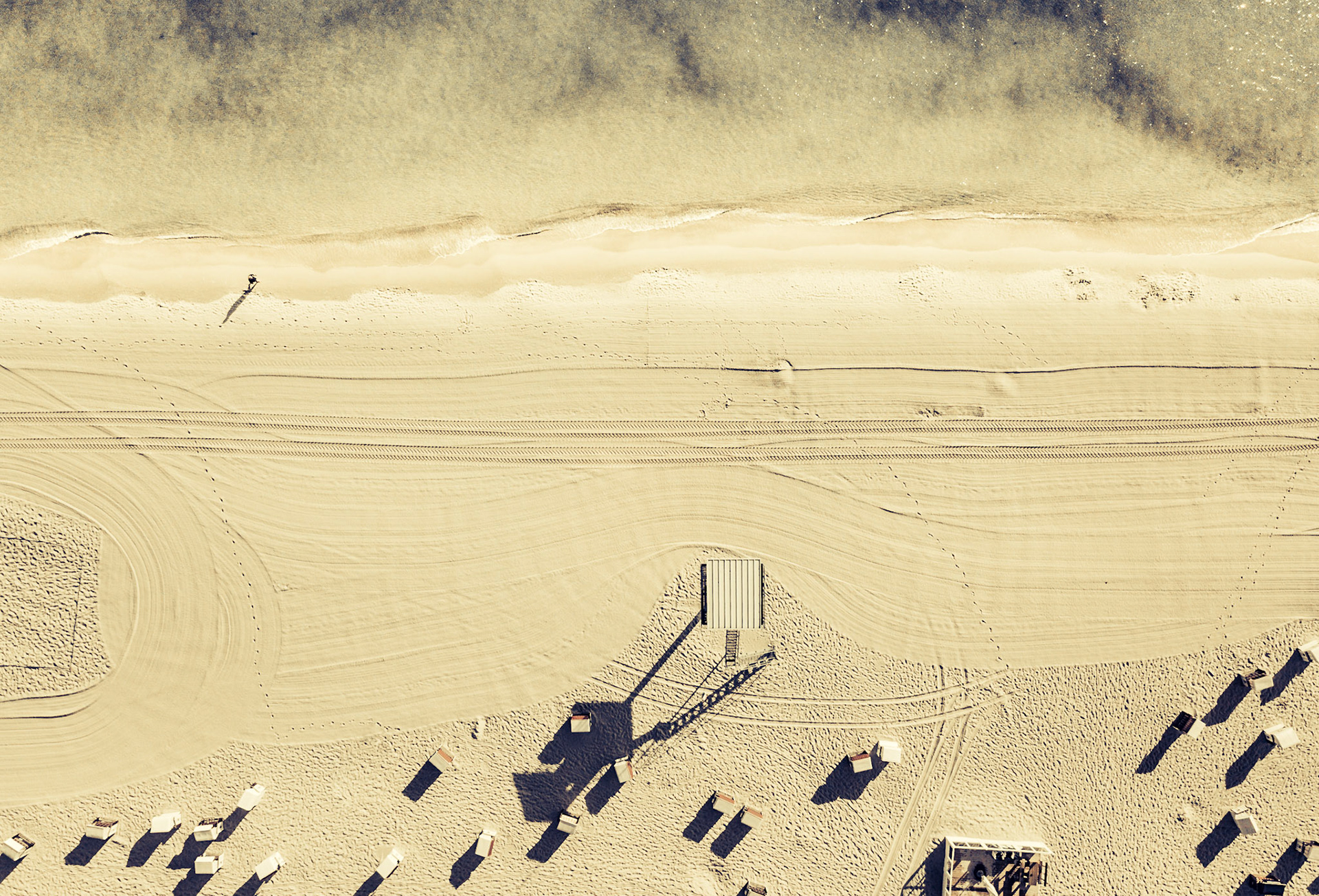 Beach with beach chairs and lifeguard tower