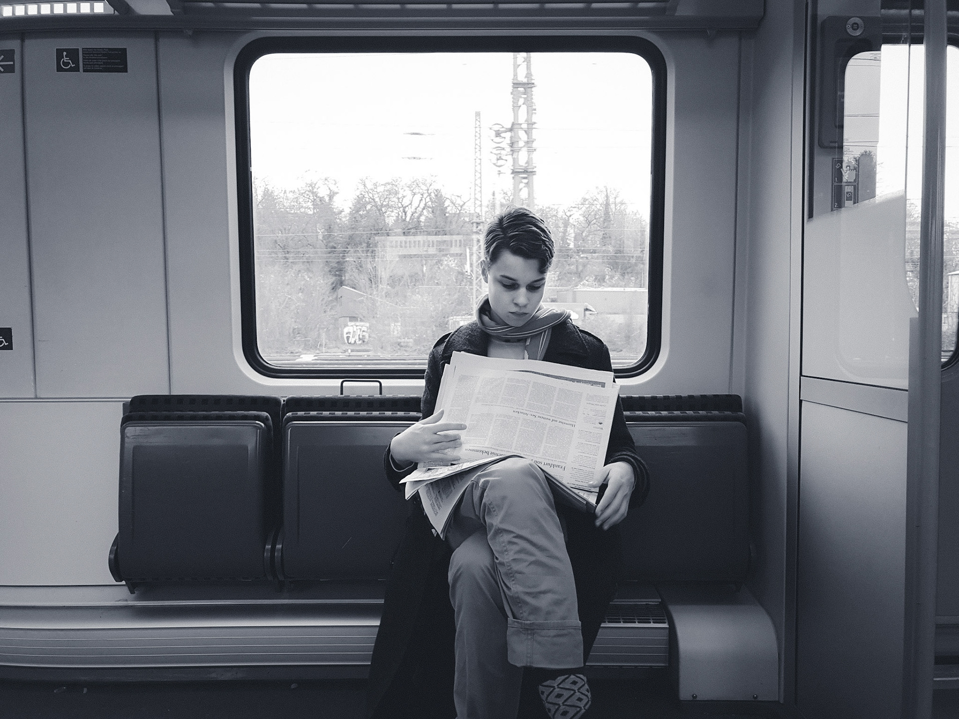 Vincent with newspaper in commuter train