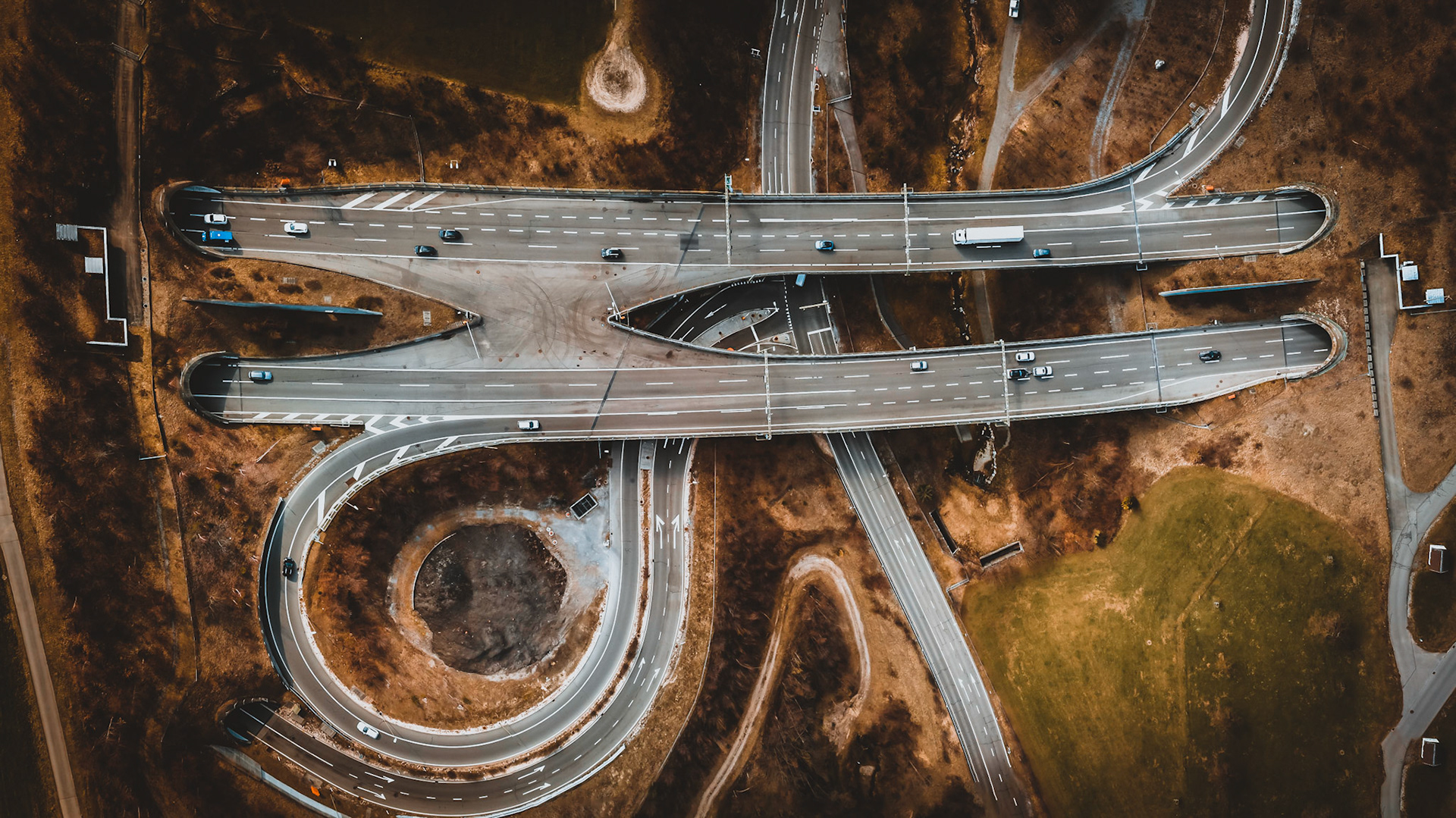A Swiss Highway on a bridge between two tunnels with an exit