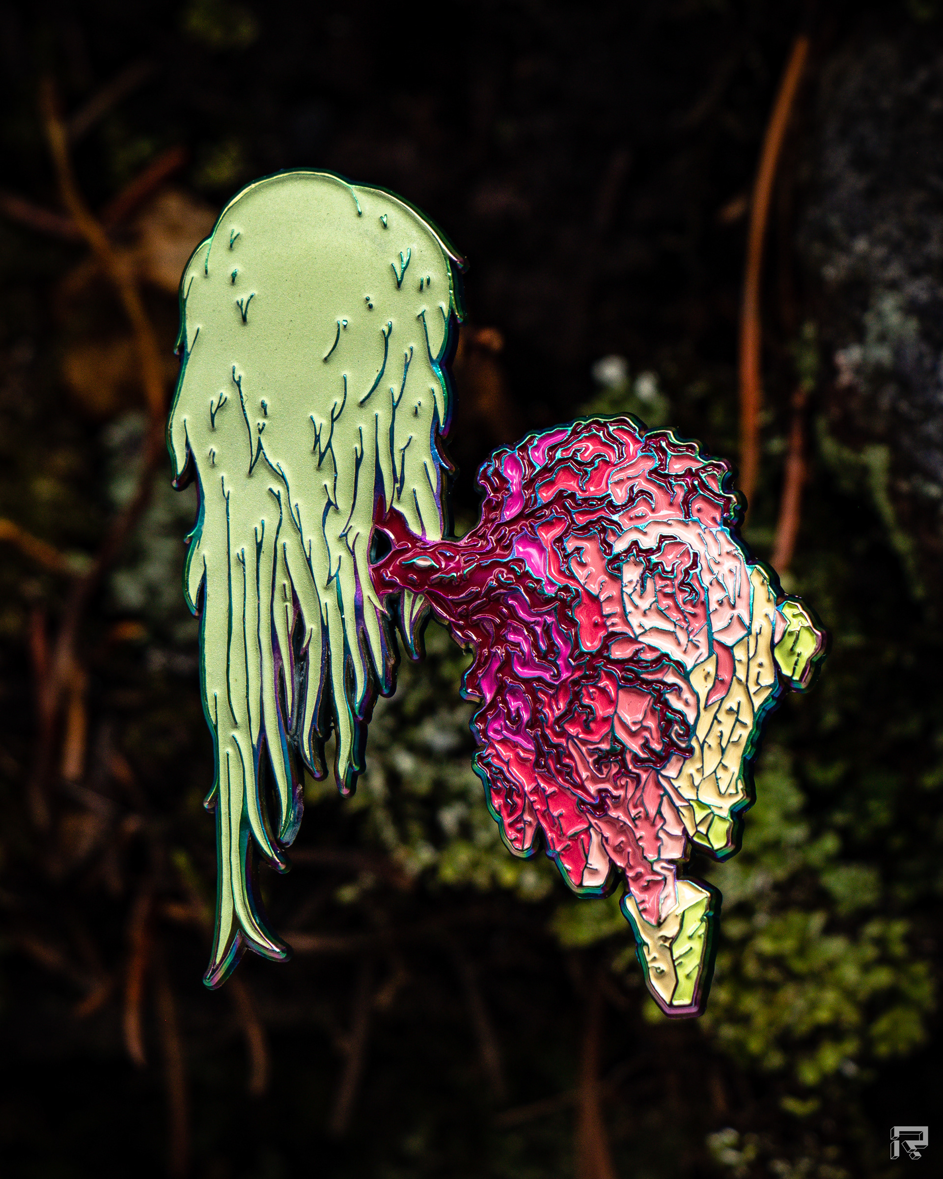 Enamel pin of willow tree artwork on a floating rock island rainbow metal