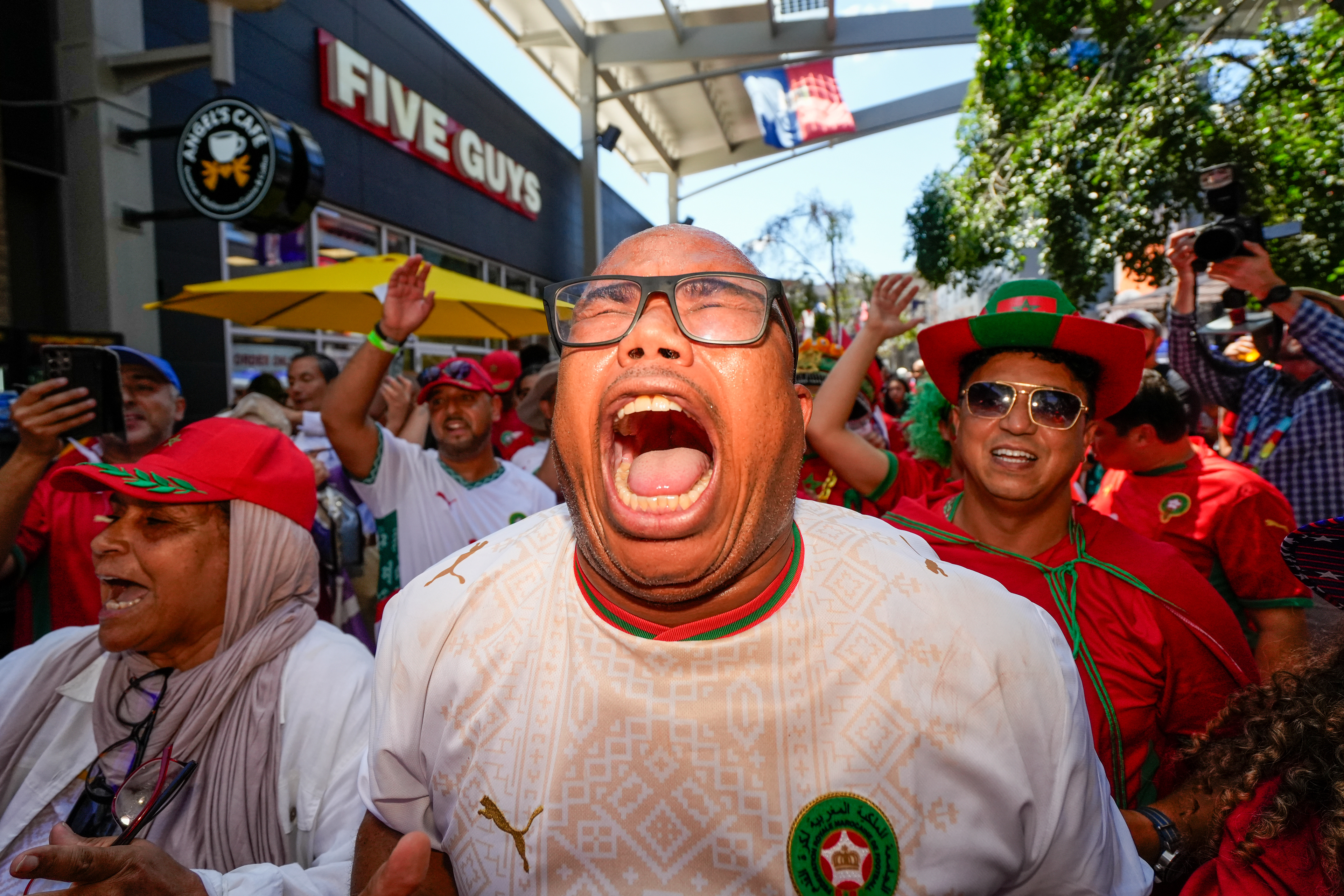 Morocco native Hamid Ghiouan leads a crowd of fans in chants before the FIFA World Cup Quarterfinal game between Morocco and France on July 9, 2026 at Patriot Place in Foxborough, Mass. France would defeat Morocco 2-0 to advance to the semi-final game against Spain.