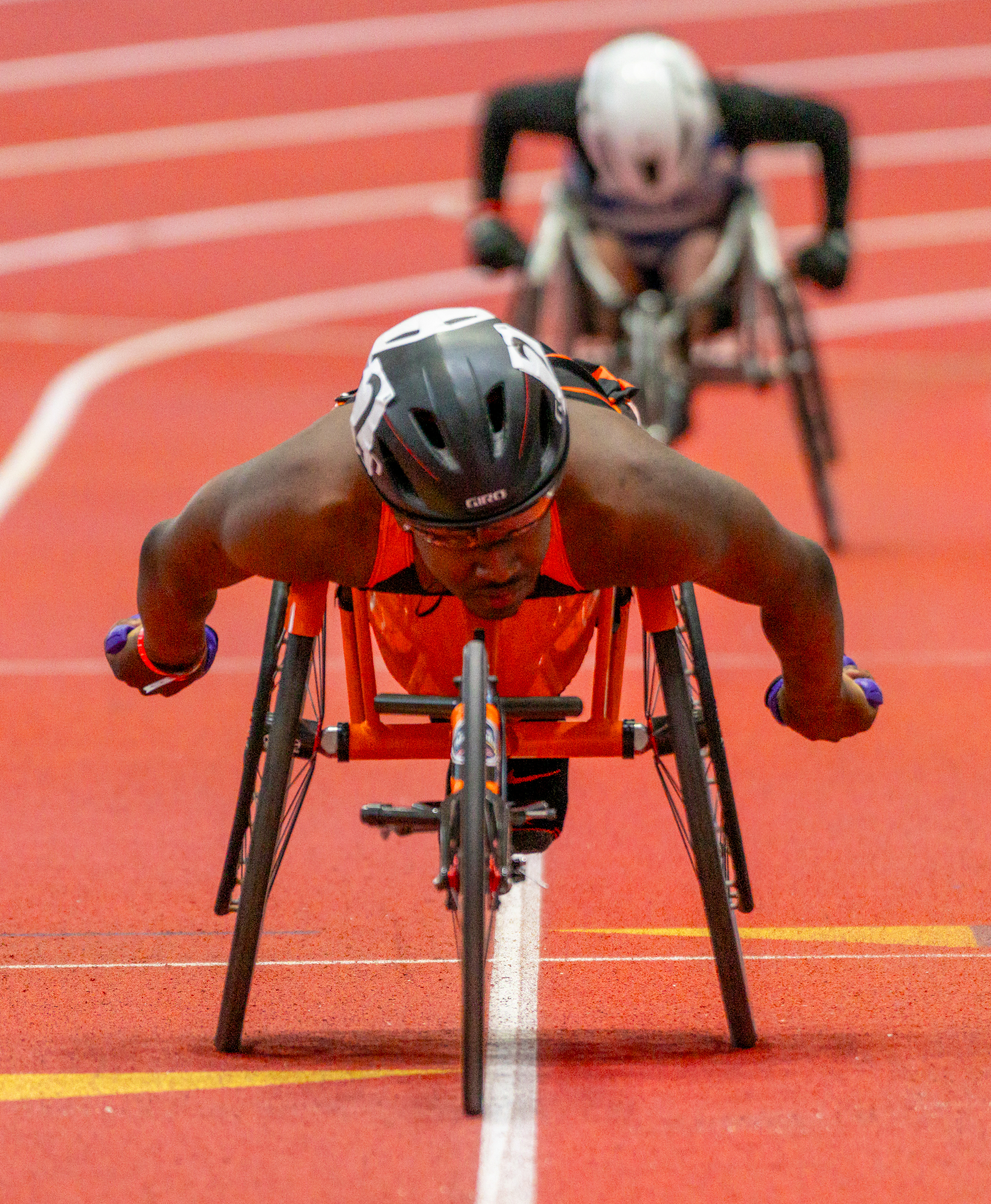Brighton High School athlete Delmace Mayo competes in the wheelchair 1-mile race at New Balance Indoor Nationals on March 16, 2025 at The TRACK at New Balance in Boston. Mayo won the event in 4:10.54, claiming his third consecutive New Balance Nationals title.