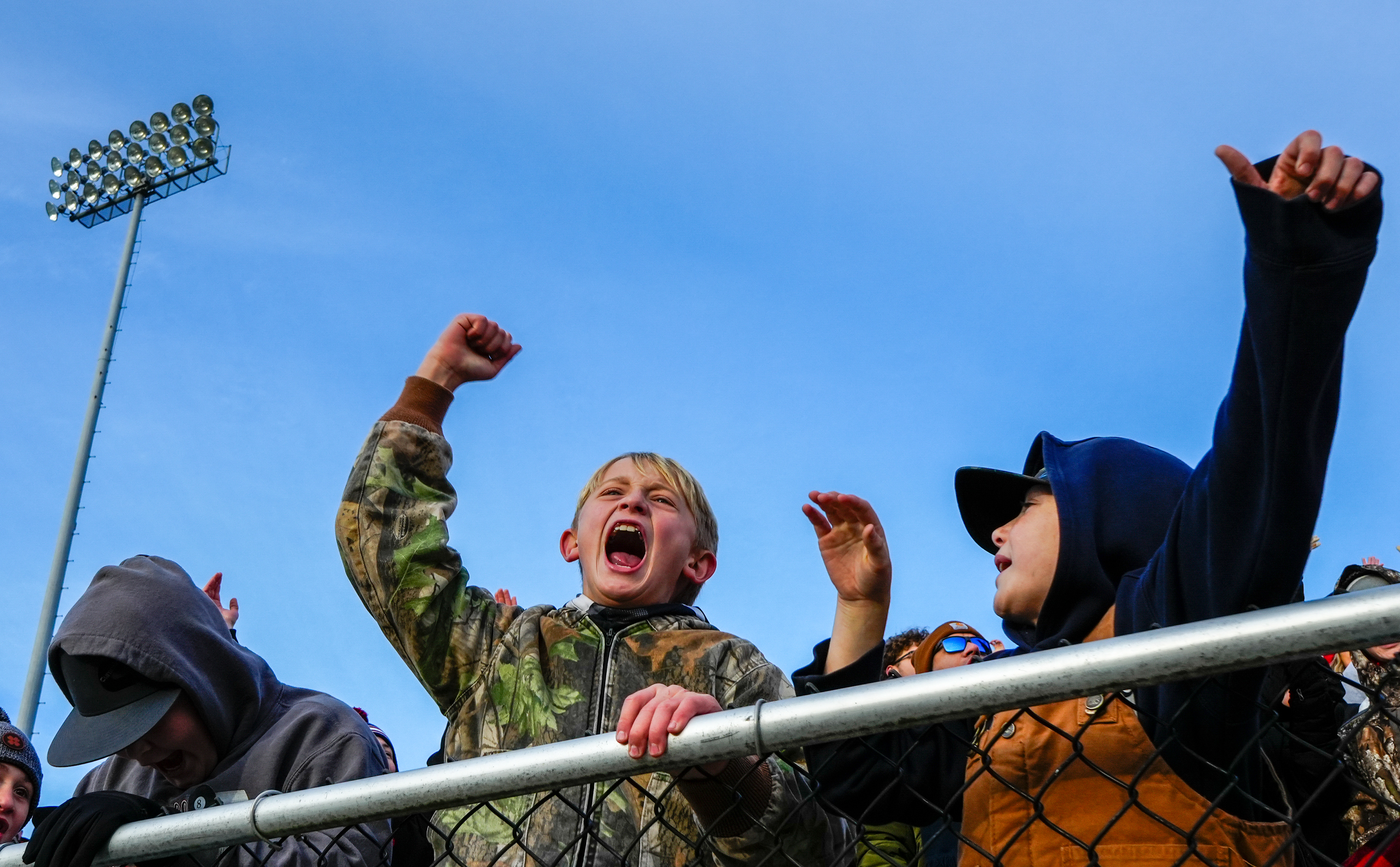 Tipton youth Easton, 10, and Kinzer, 10, cheer during the second half of the MSHSAA Class 1 State Championship against Putnam County on Dec. 5, 2025 at Spratt Stadium in St. Joseph, Mo. Tipton held Putnam County scoreless in the second half to win 39-14.