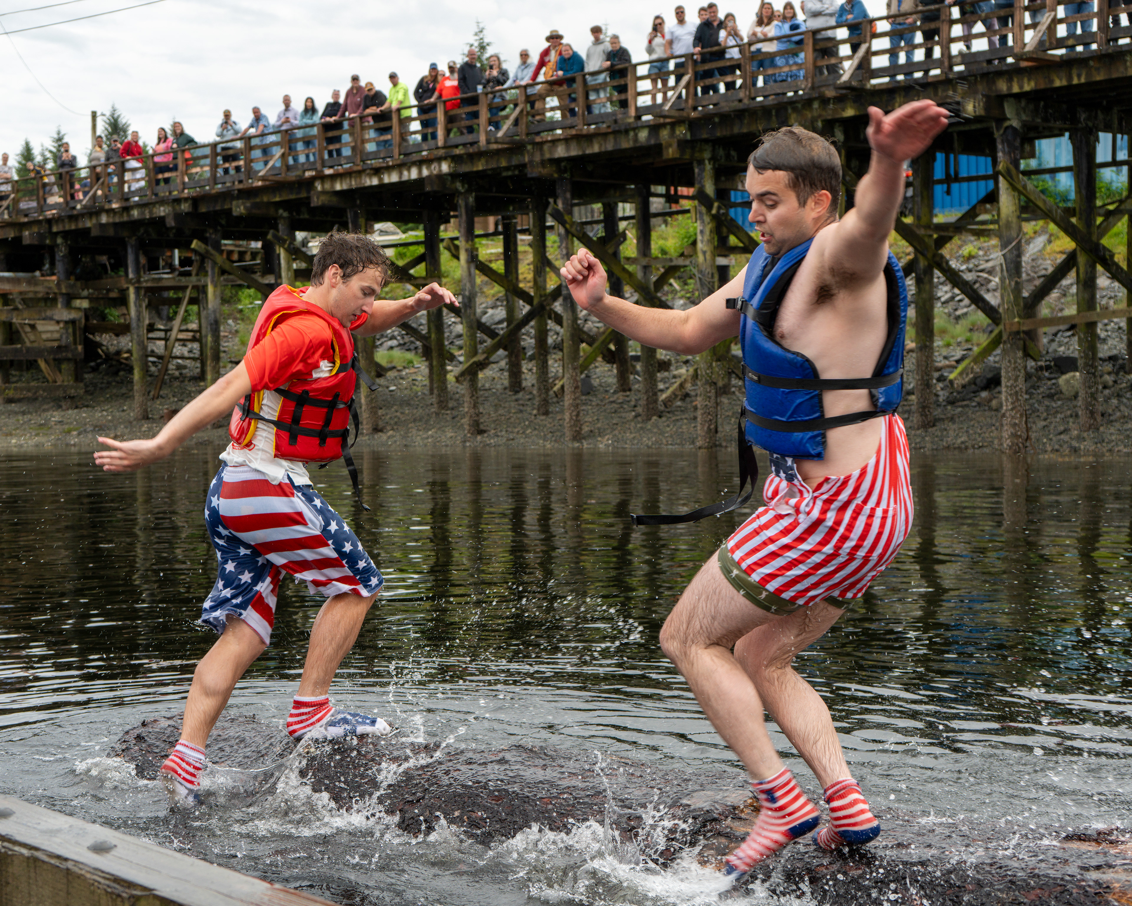 Britton Erickson and Dalton Smalls battle for the Petersburg log rolling championship on July 4, 2025 in Petersburg, Alaska.