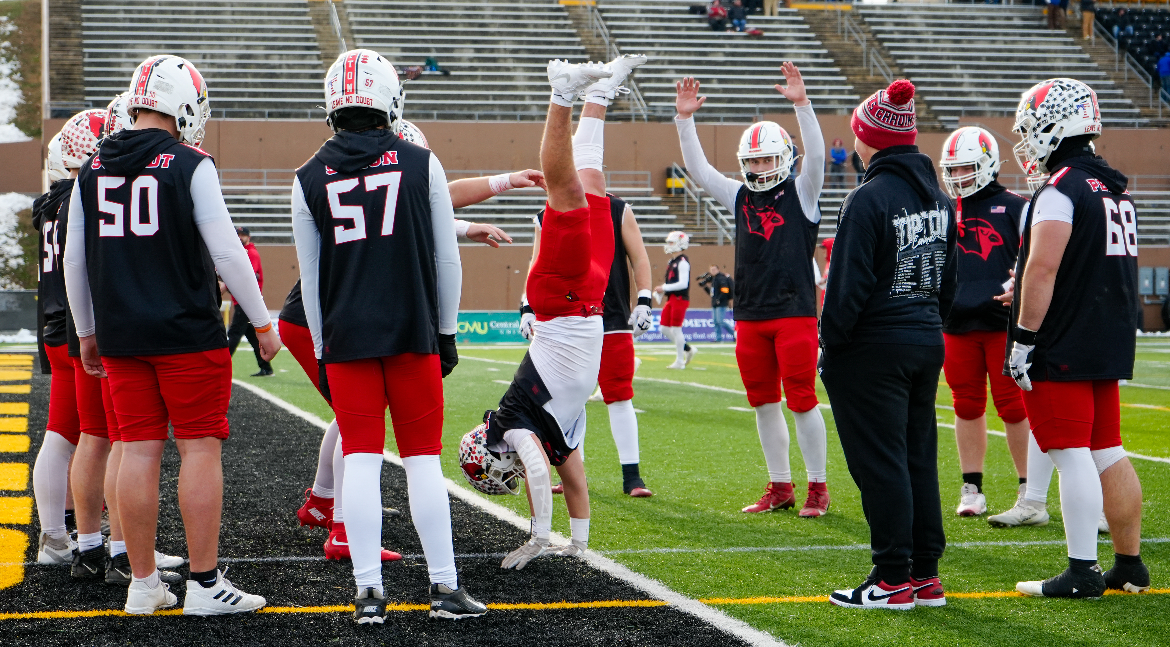 Tipton right guard Ben Bestgen handstands while warming up before the MSHSAA Class 1 State Championship against Putnam County on Dec. 5, 2025 at Spratt Stadium in St. Joseph, Mo. The temperature was 43 degrees with 11mph winds at kickoff.