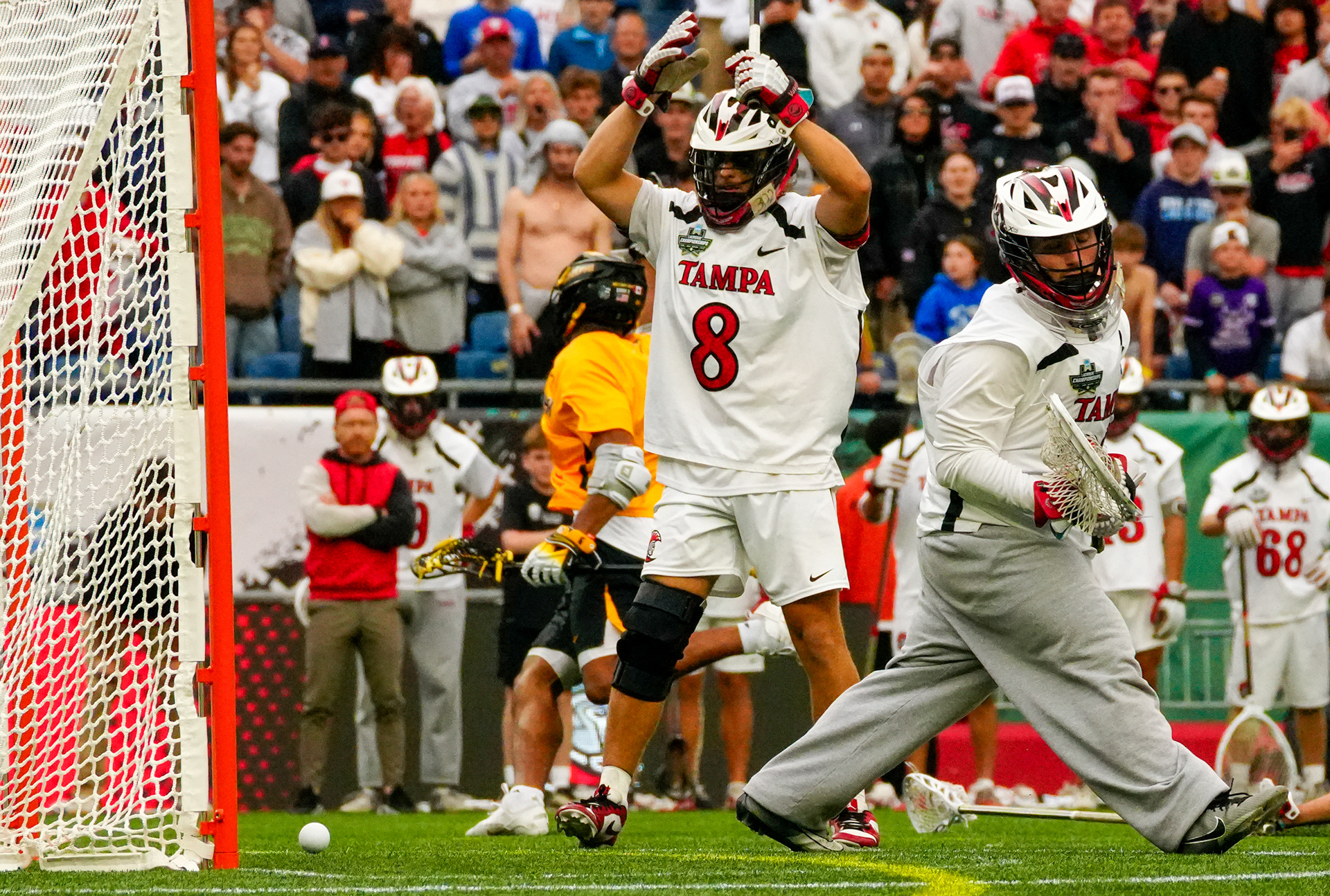 Tampa senior Dom Rottura, #8, watches in horror as the game-winning overtime goal slips past goalie Connor Theriault in the NCAA DII National Championship, losing 9-8 to Adelphi on May 25, 2025 at Gillette Stadium in Foxborough, Mass.