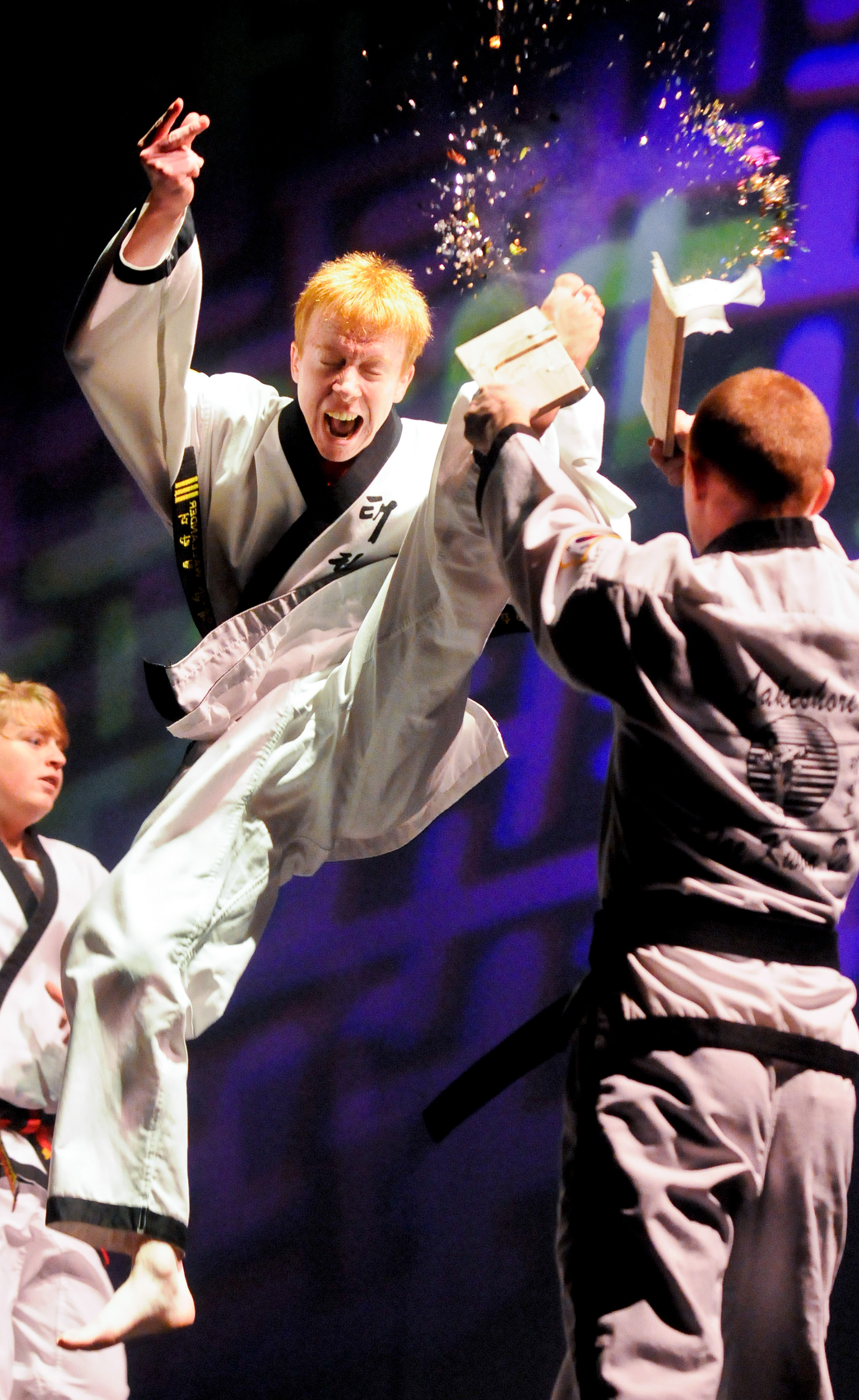 Gavin Wallander of Newton splits a board in mid-air during the Lakeshore Tae Kwon Do Black Belt Spectacular event, which was held recently at the Capitol Civic Centre in Manitowoc. Doug Sundin/HTR November 2, 2008