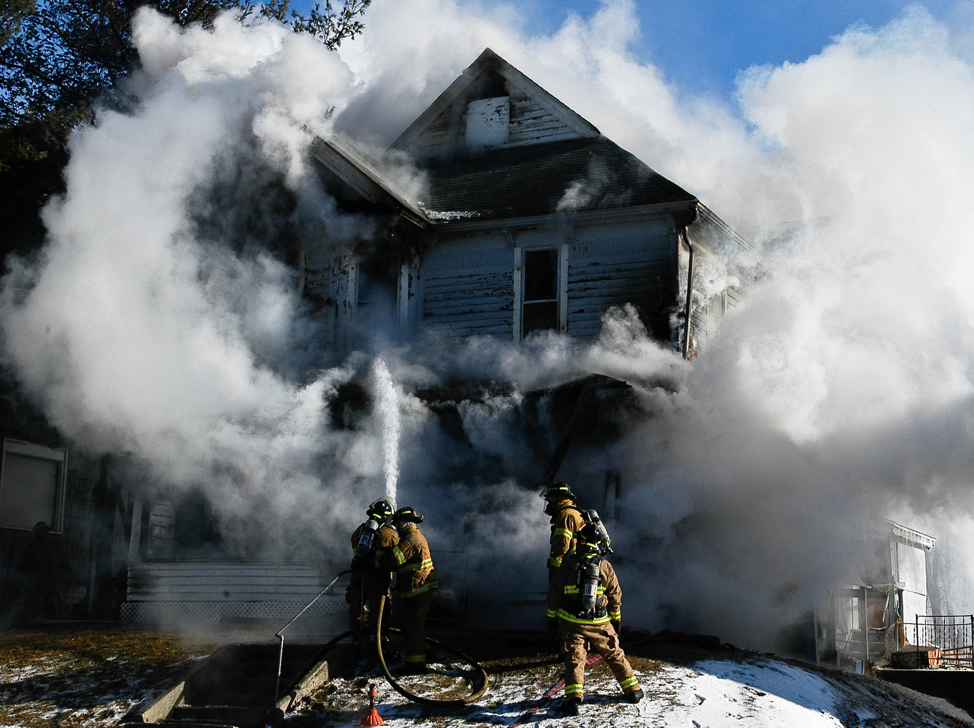 A house fire broke out on the 100 block of South Iowa Avenue Saturday morning. - Courier Photo by: Doug Sundin